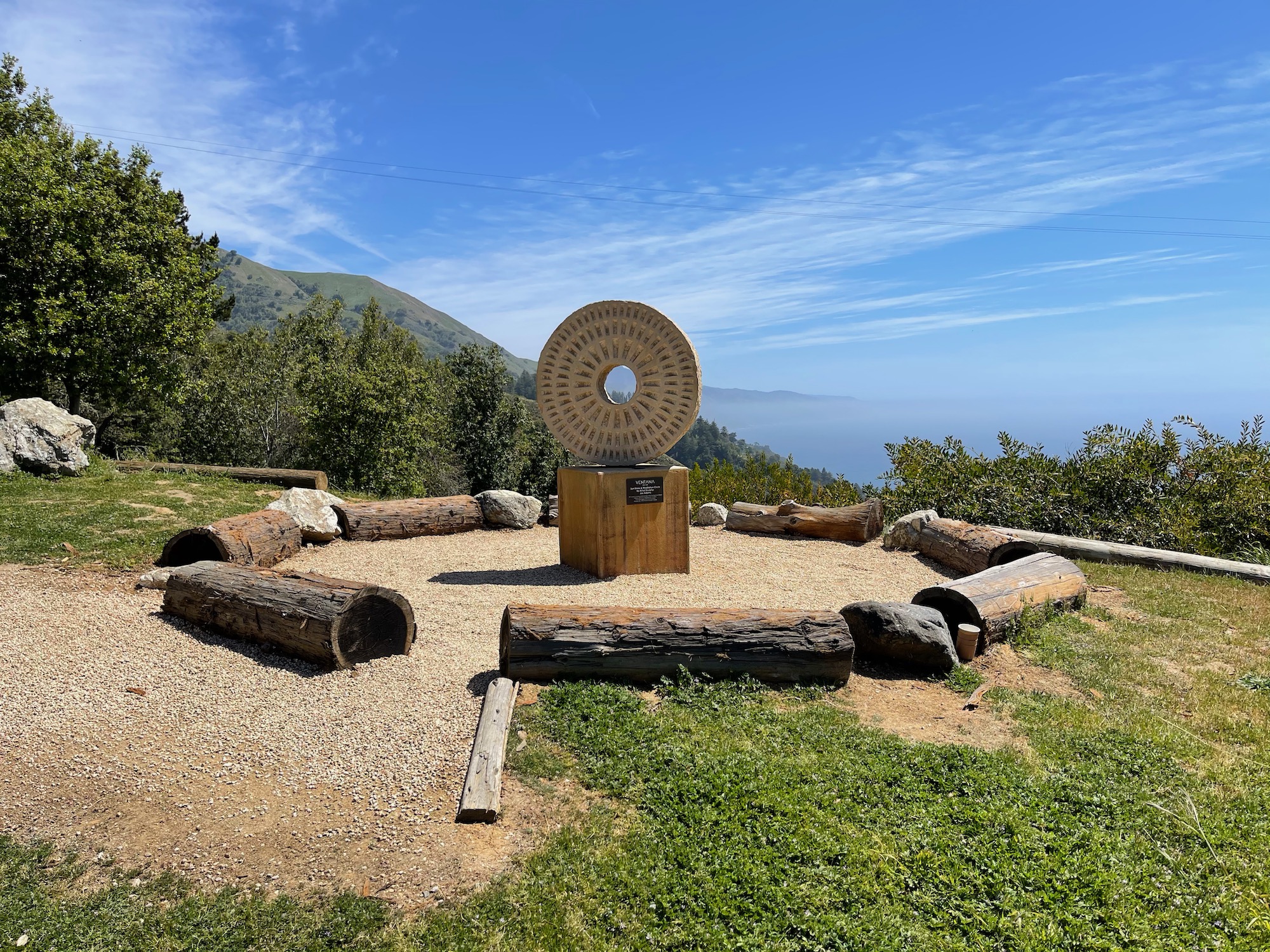 a circular object in a circle surrounded by logs