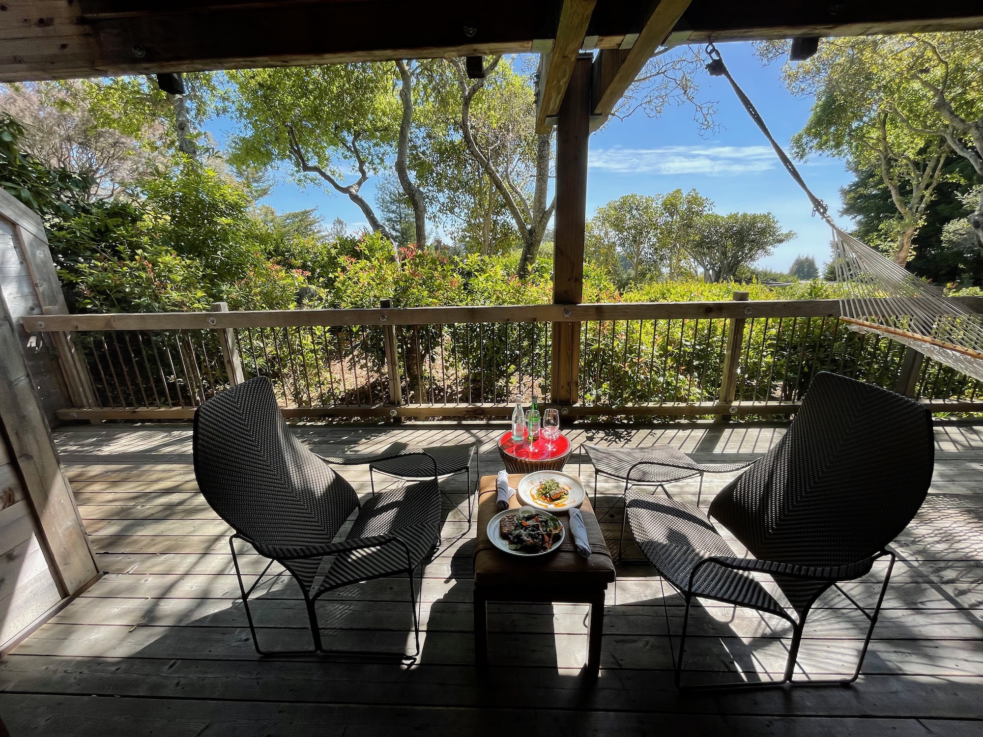 a table and chairs on a deck