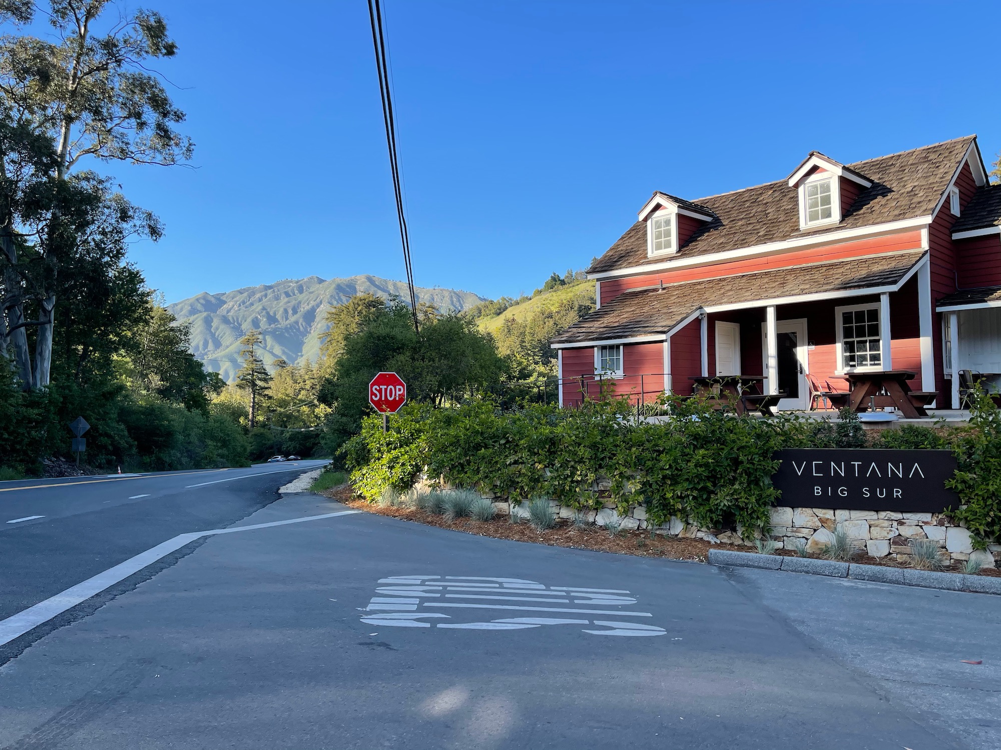 a house with a stop sign on the side of the road