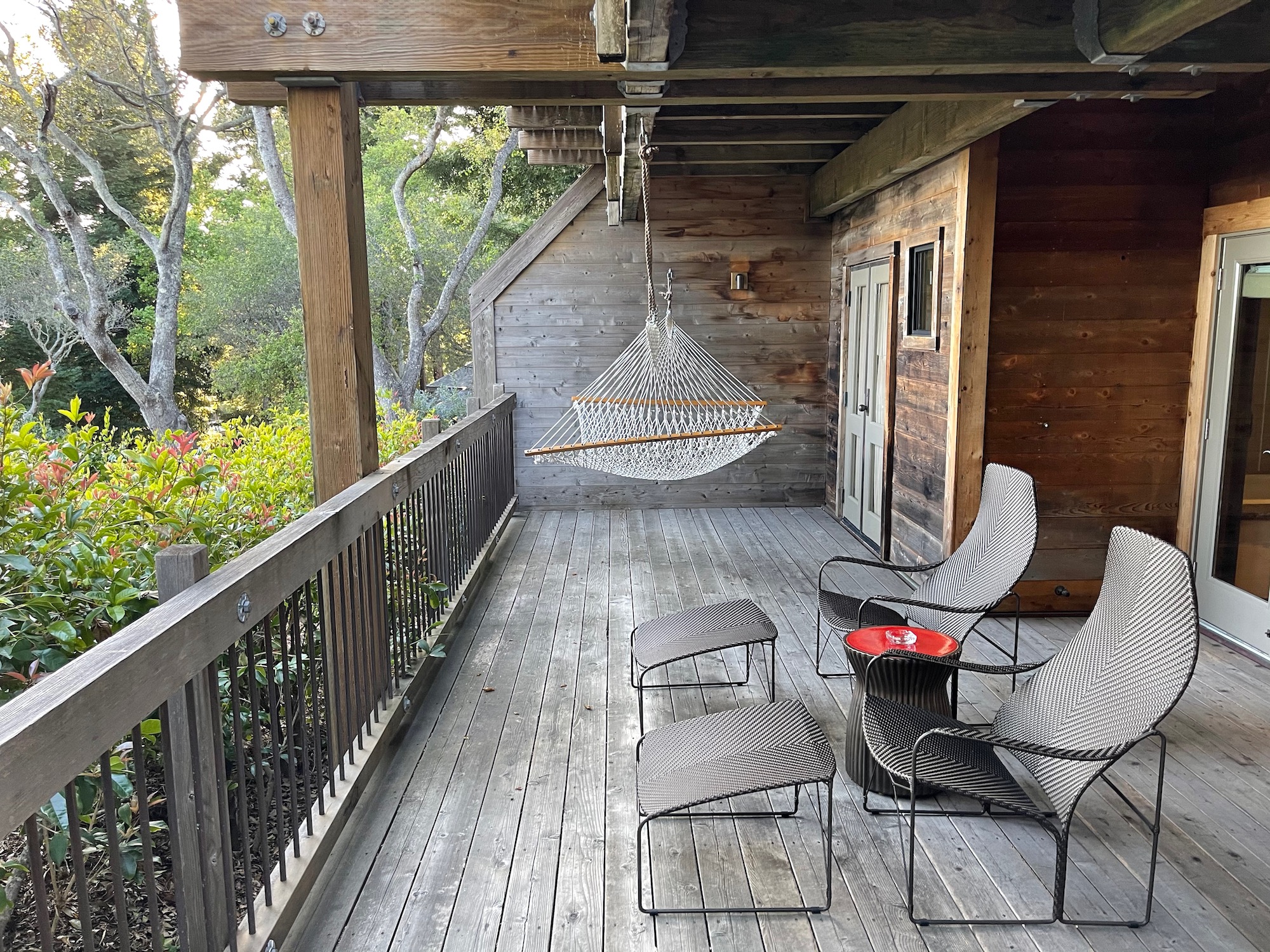 a deck with chairs and a table