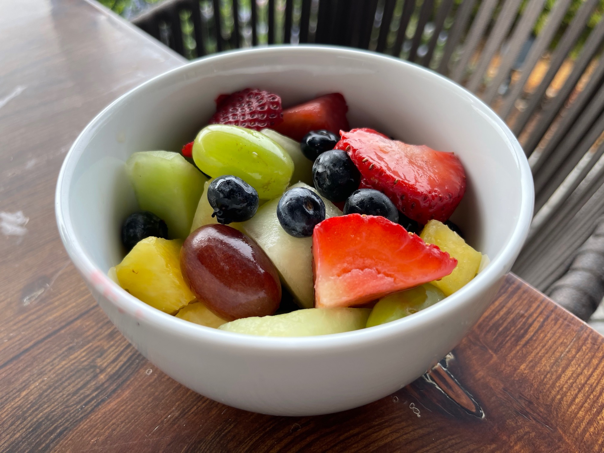 a bowl of fruit on a table