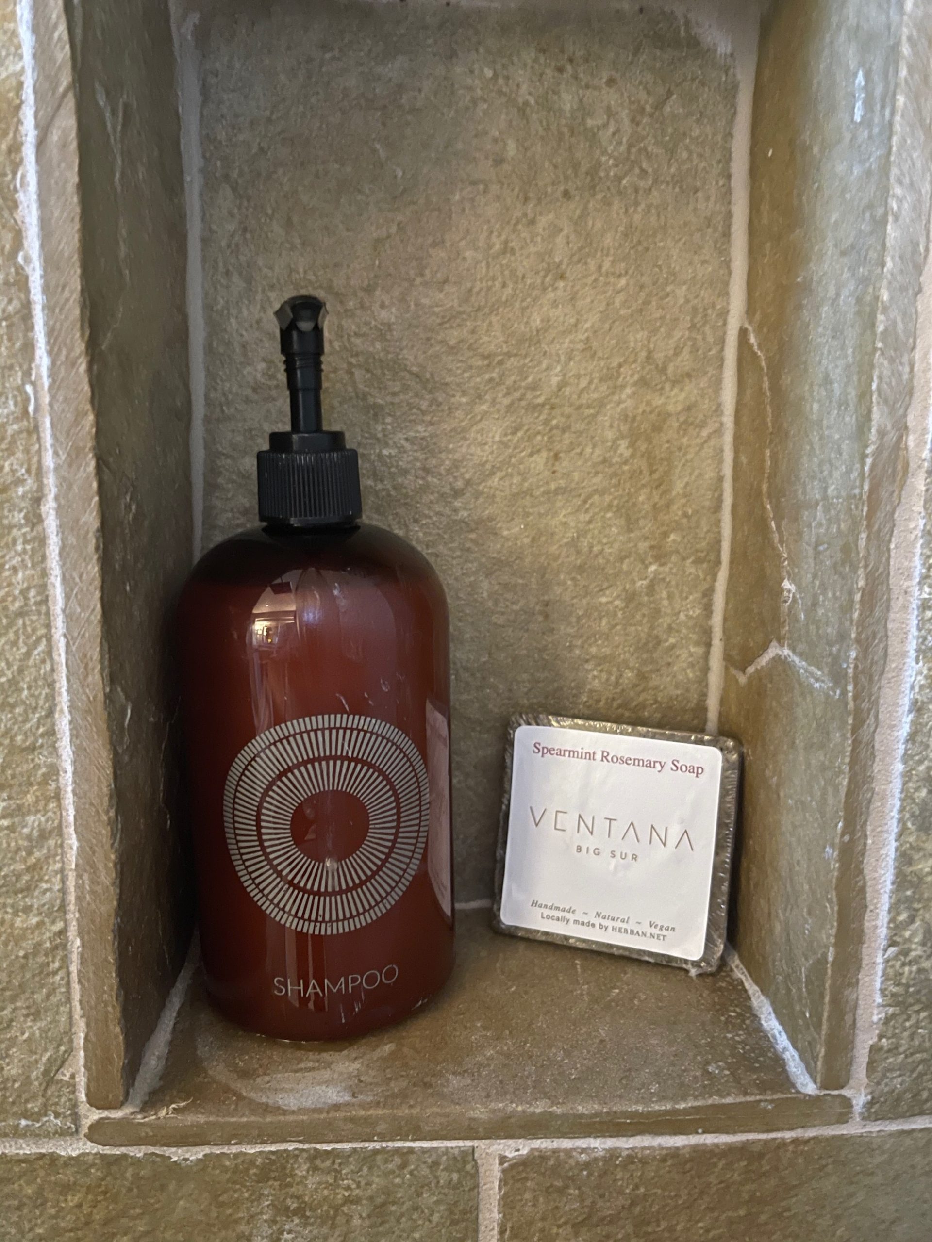 a soap dispenser and soap in a bathroom