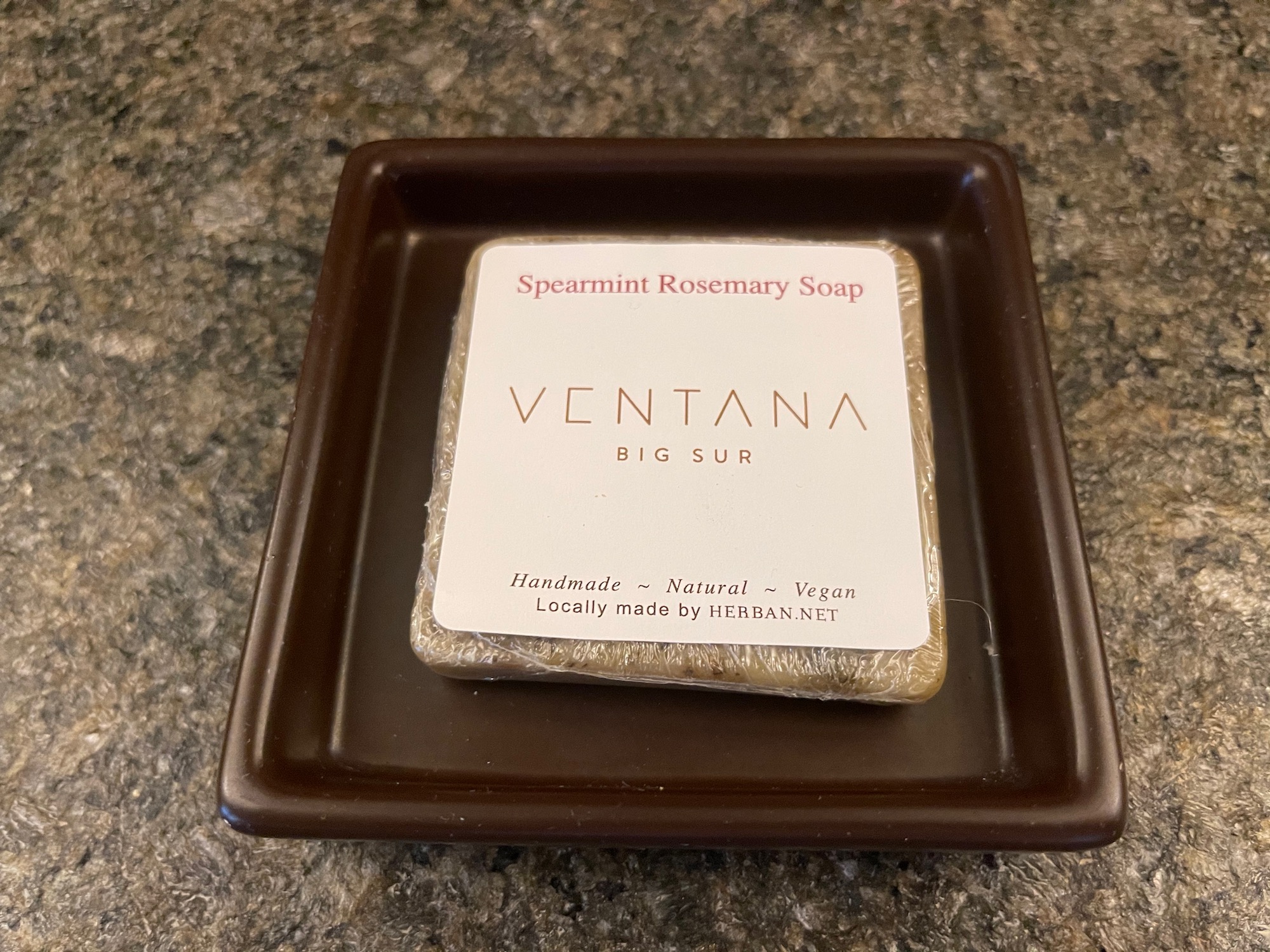 a bar of soap on a brown dish