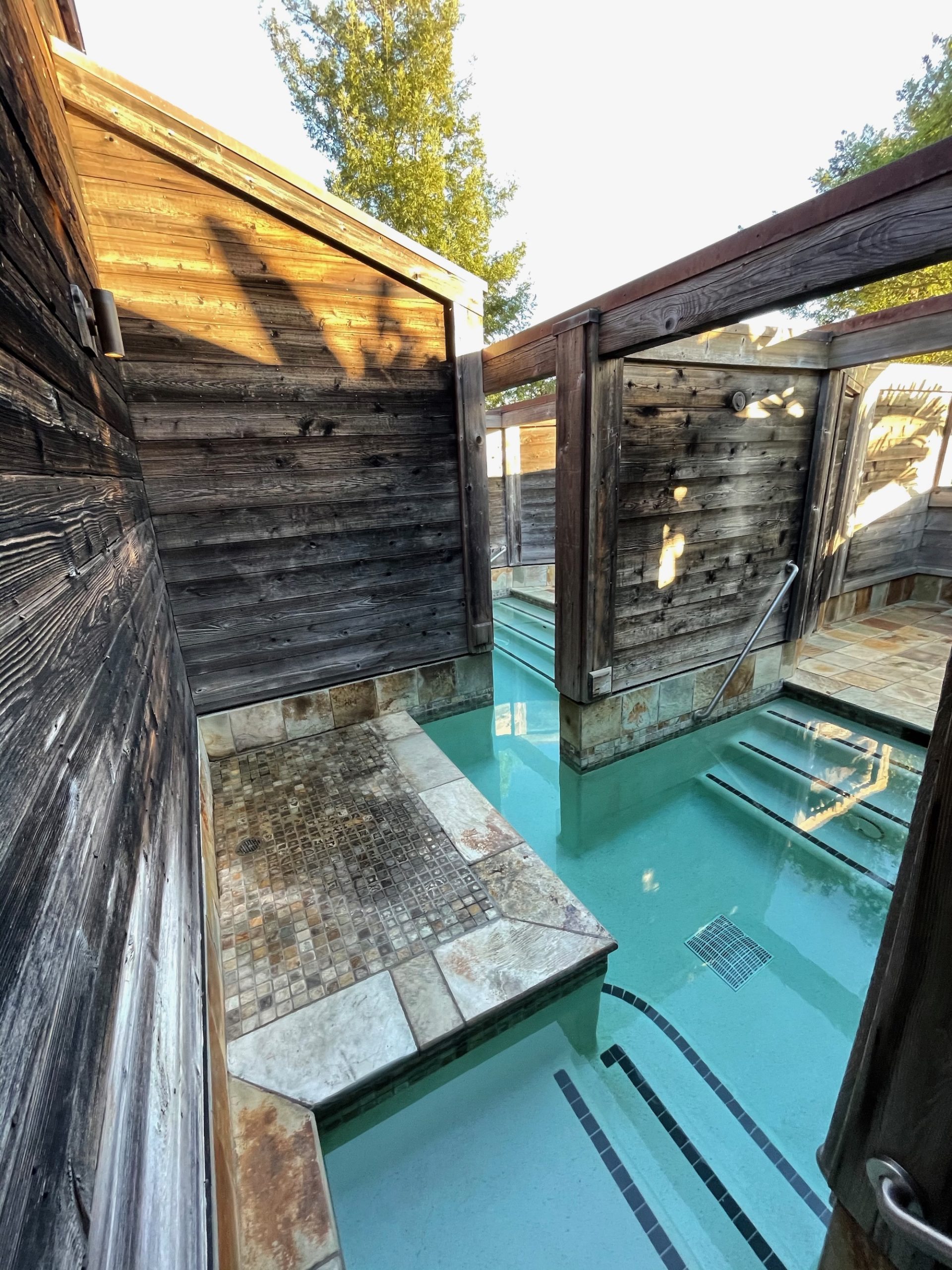 a pool with a hot tub