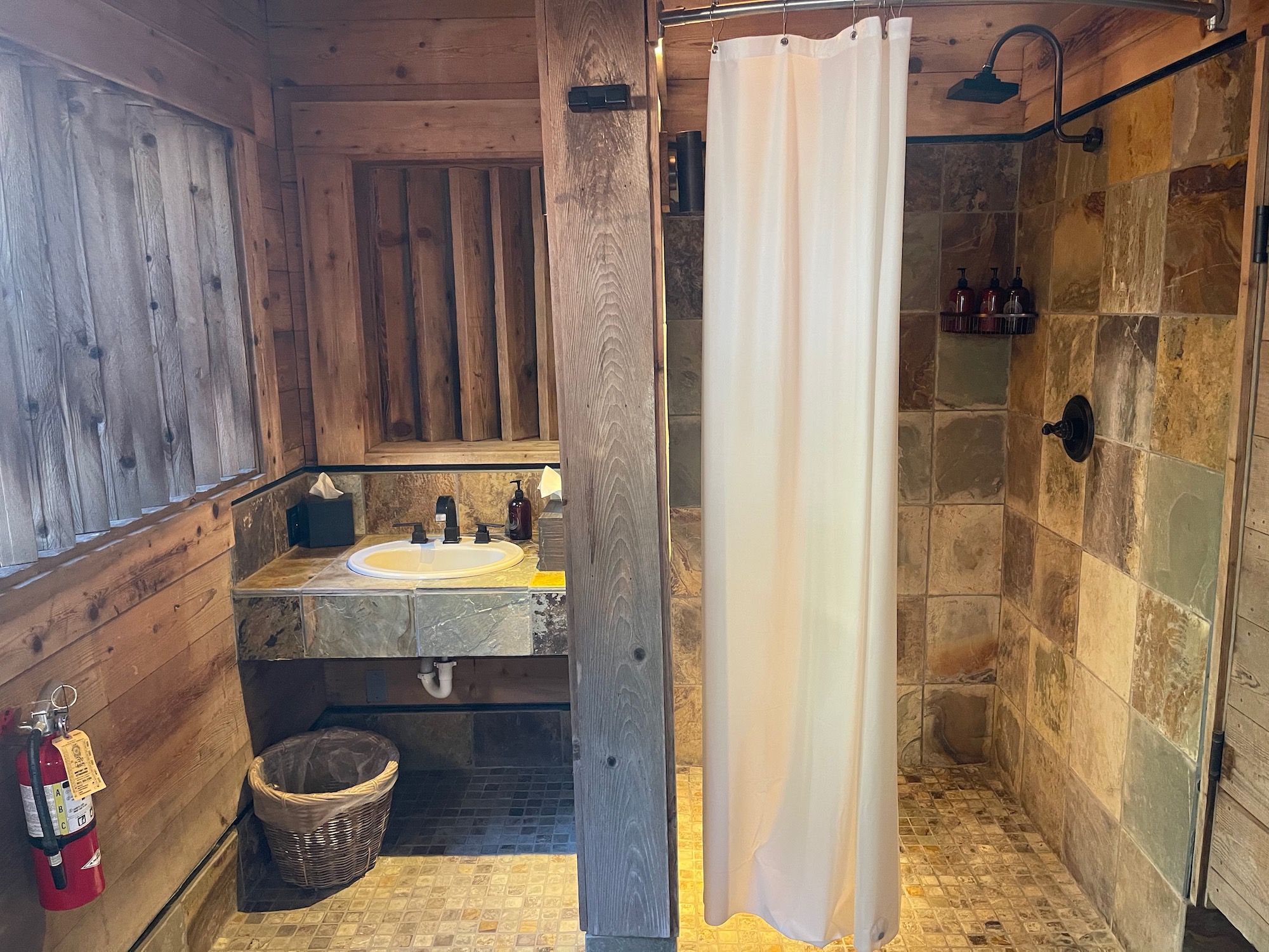 a bathroom with a shower and sink