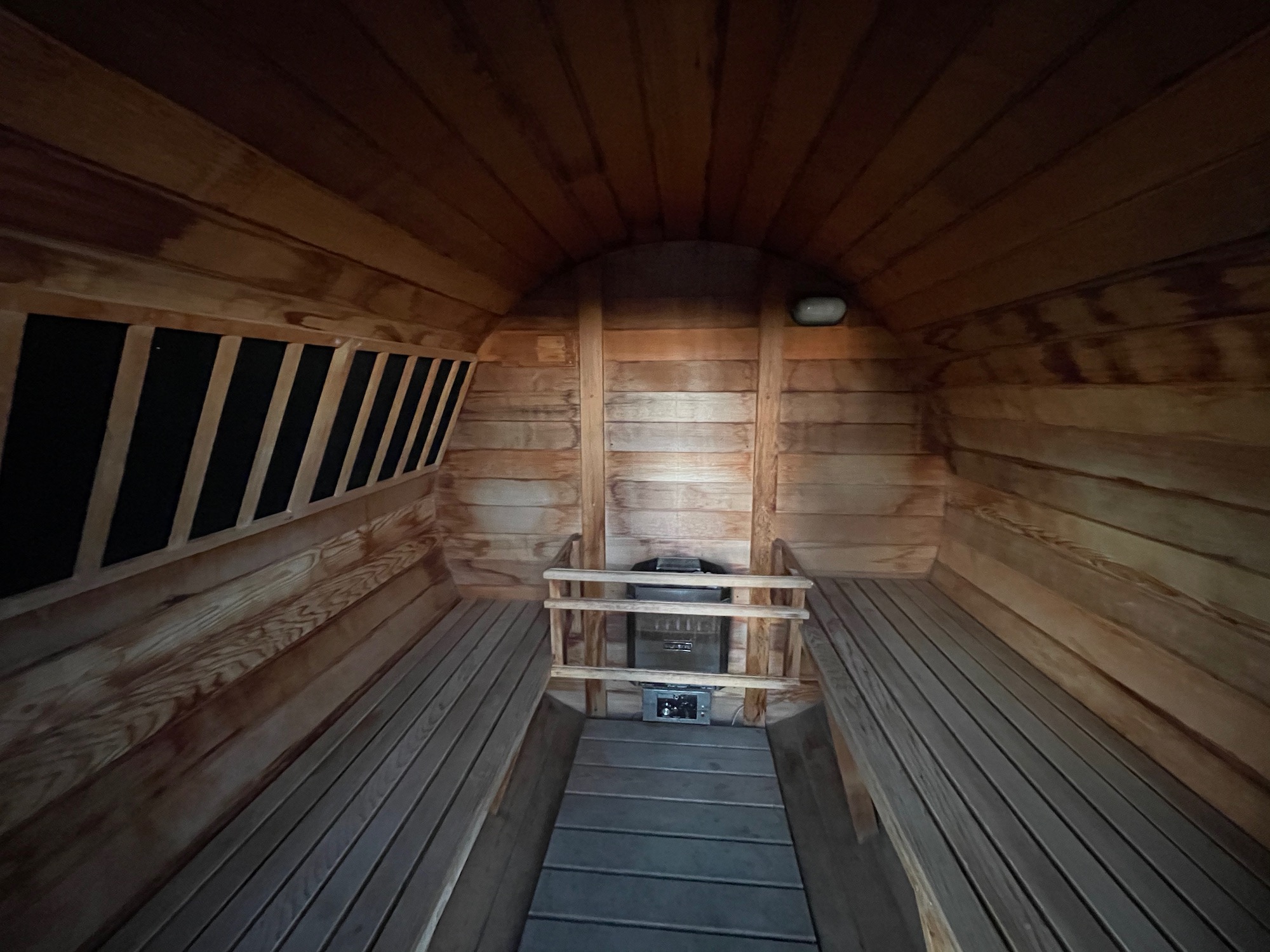 inside a wooden room with benches