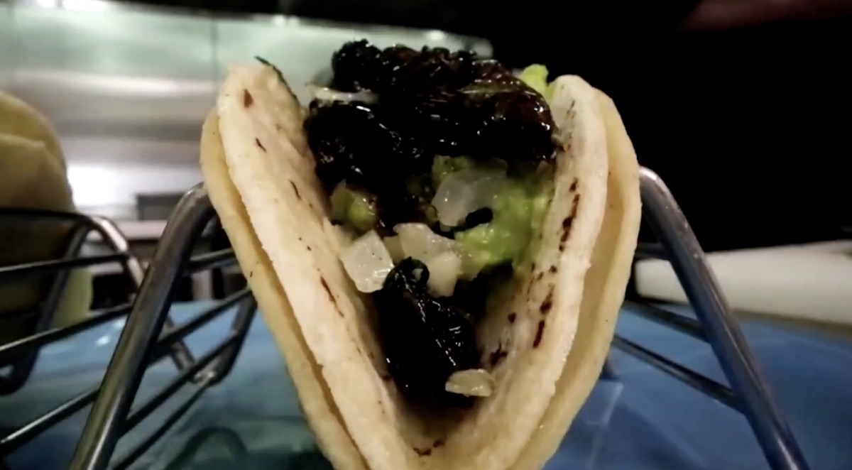 a taco with prunes and onions