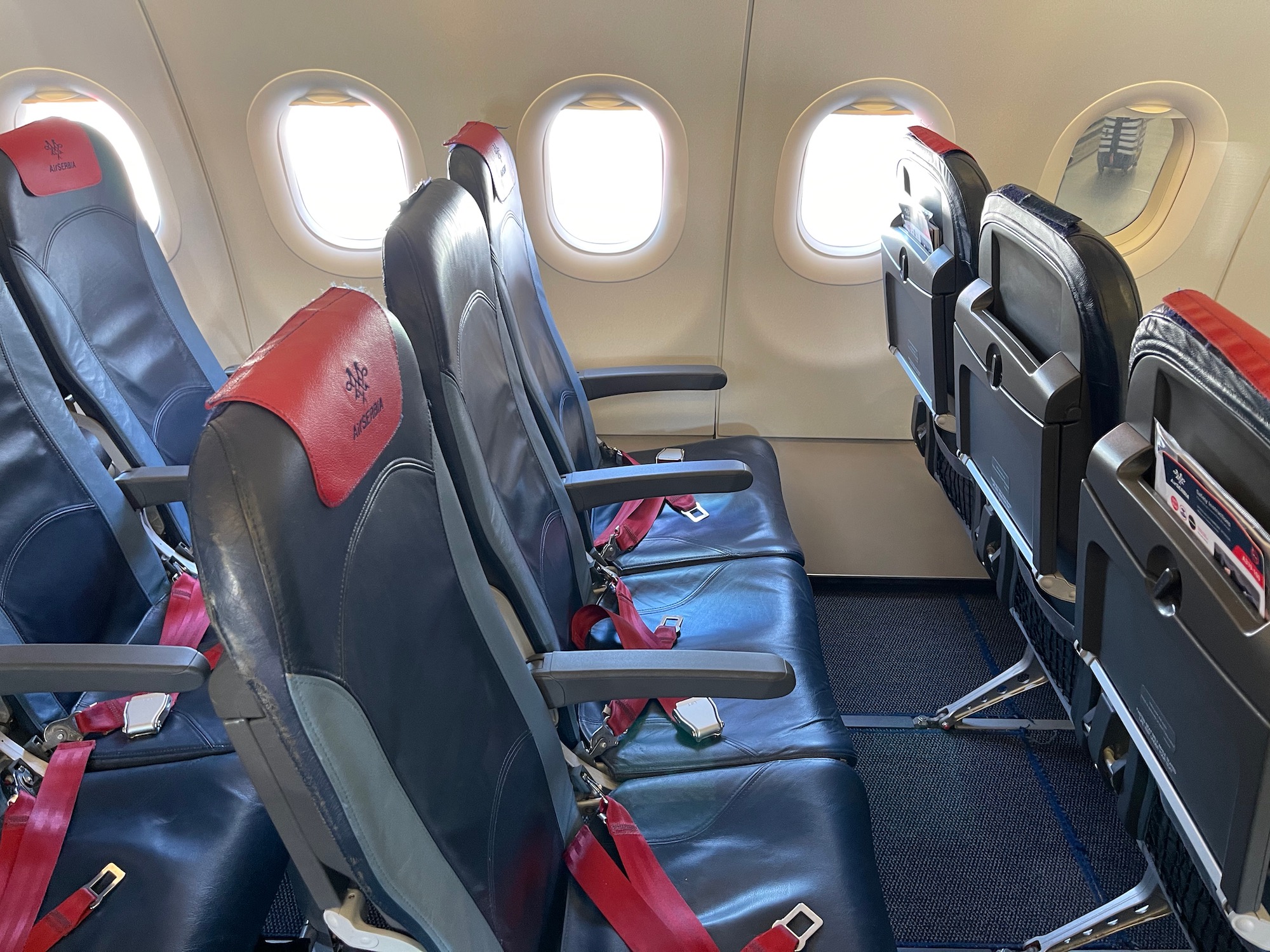 seats in an airplane with windows