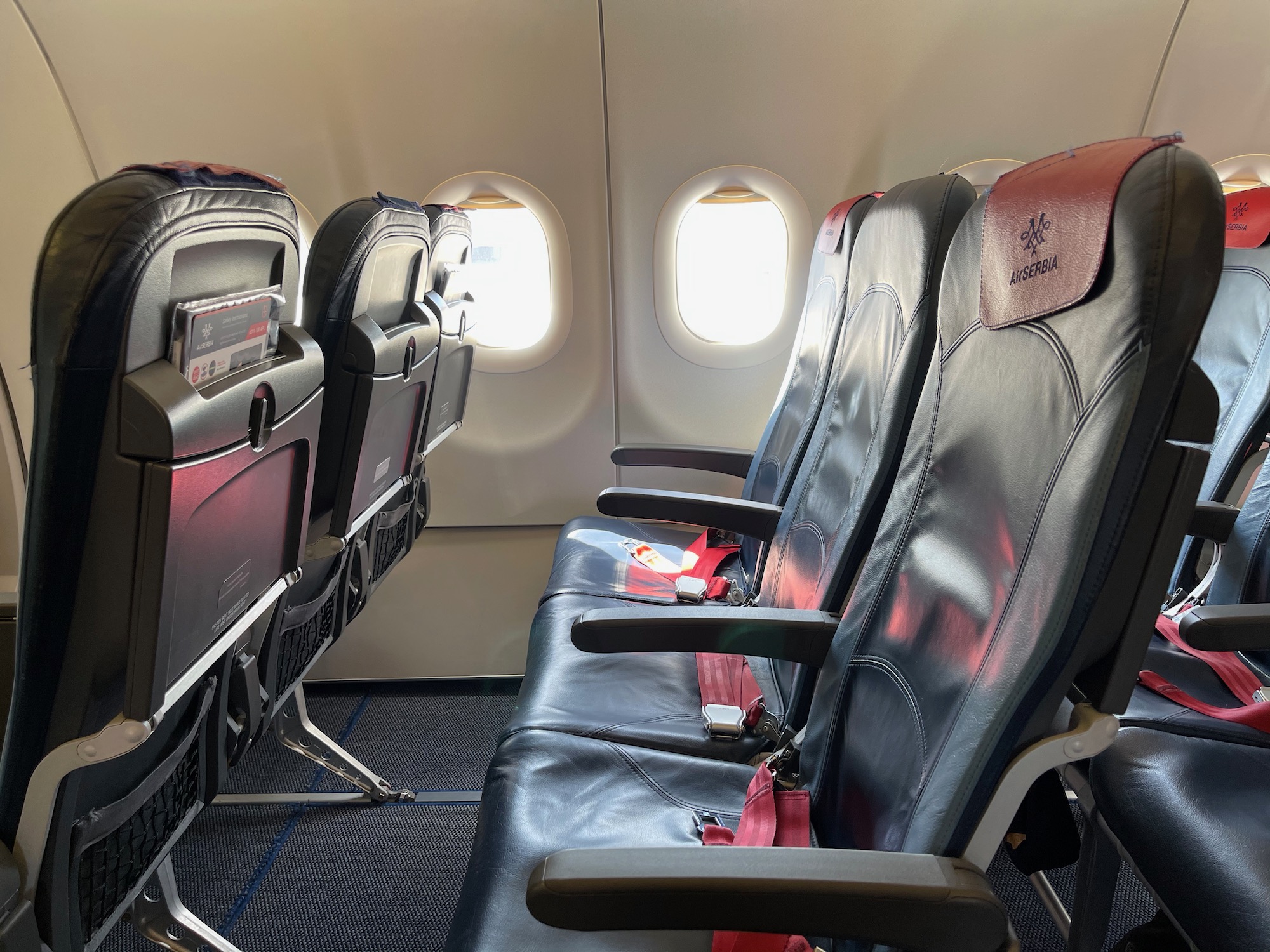 seats in an airplane with windows