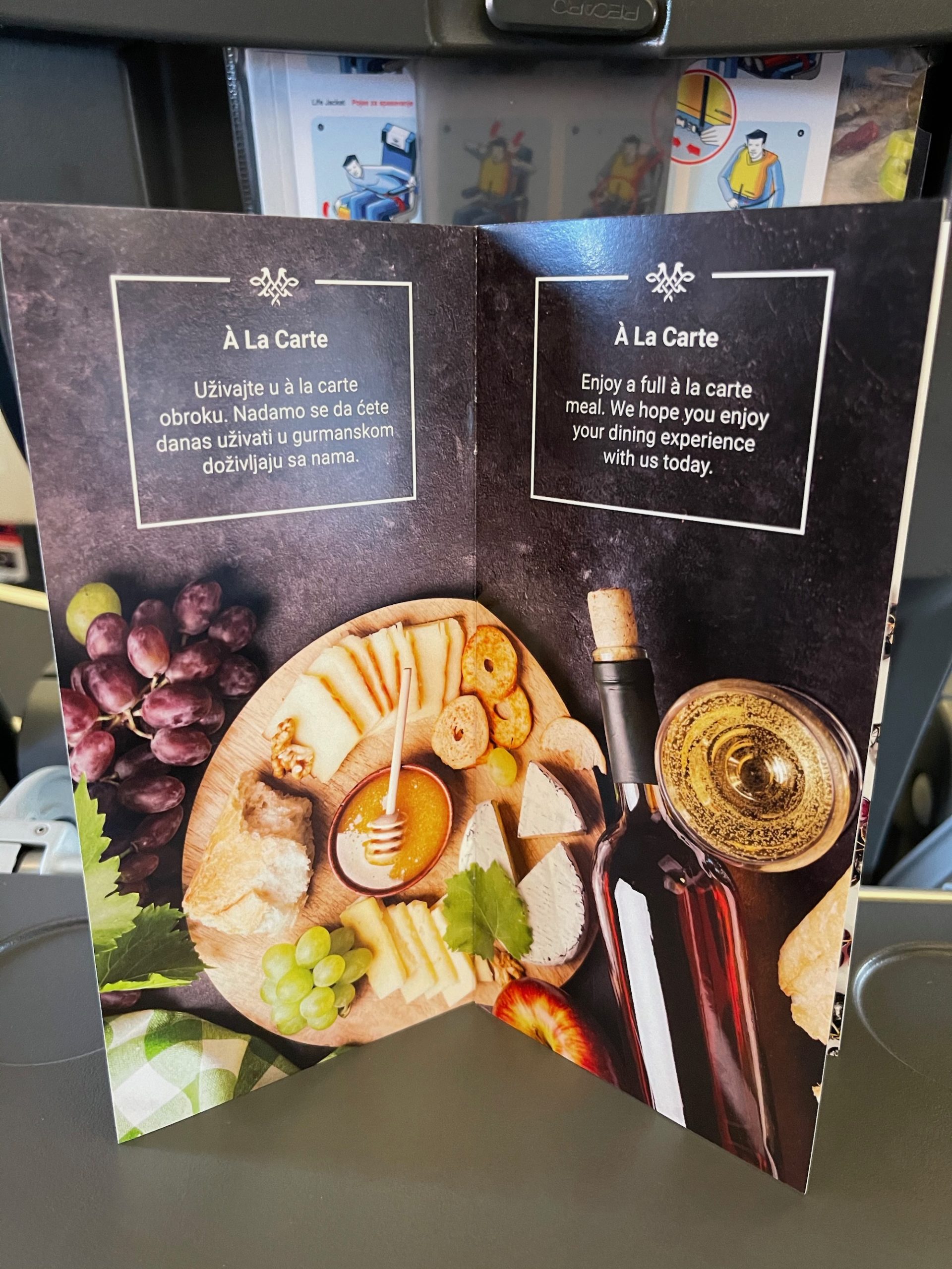 a menu with a picture of food and wine