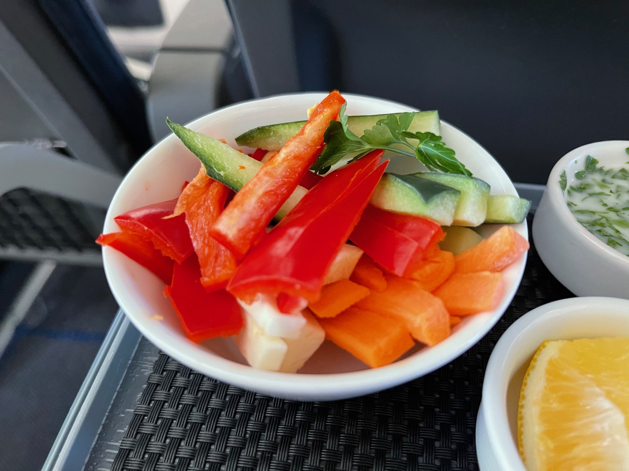 a bowl of vegetables in a white bowl