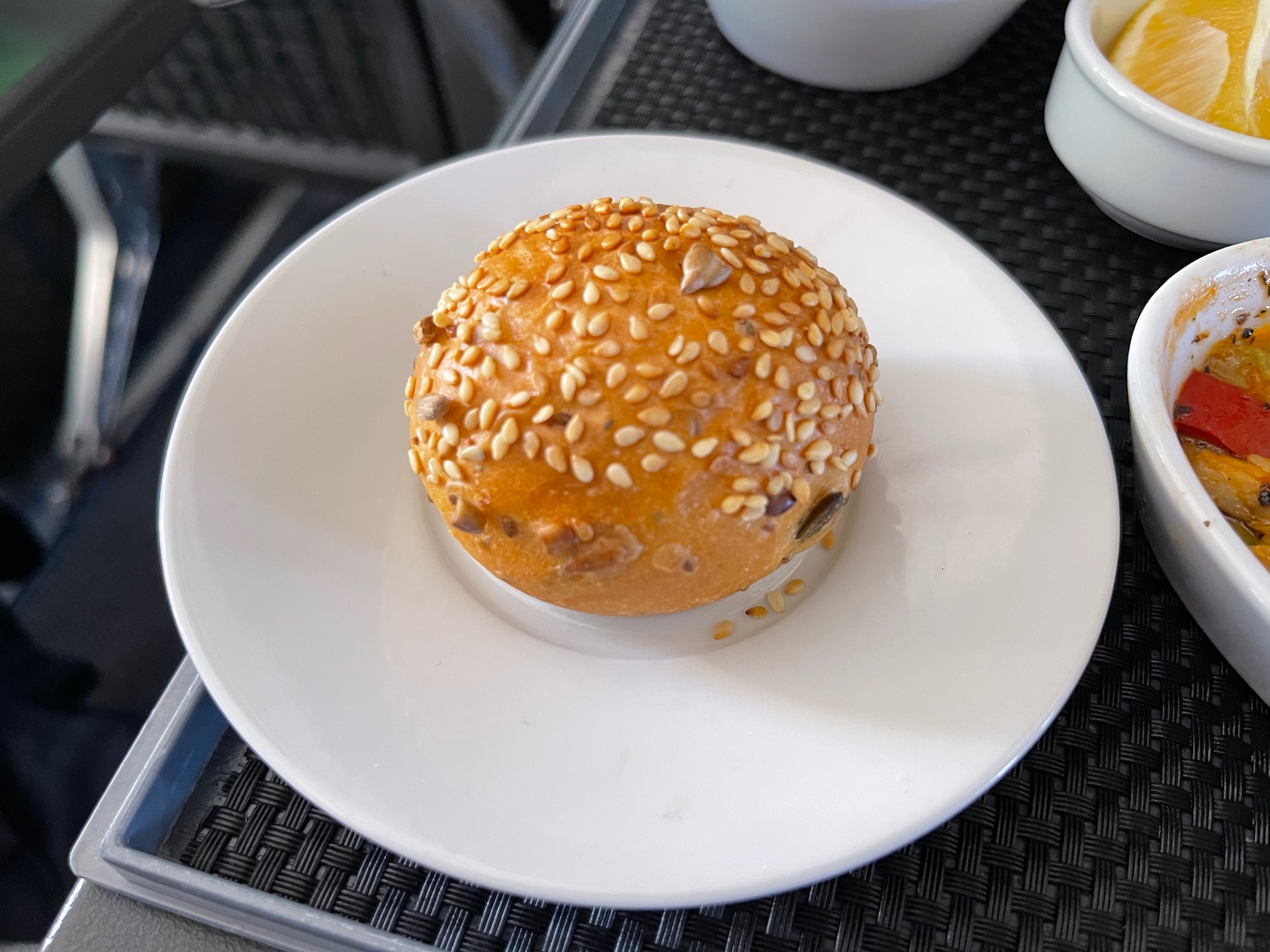 a round bread roll on a white plate