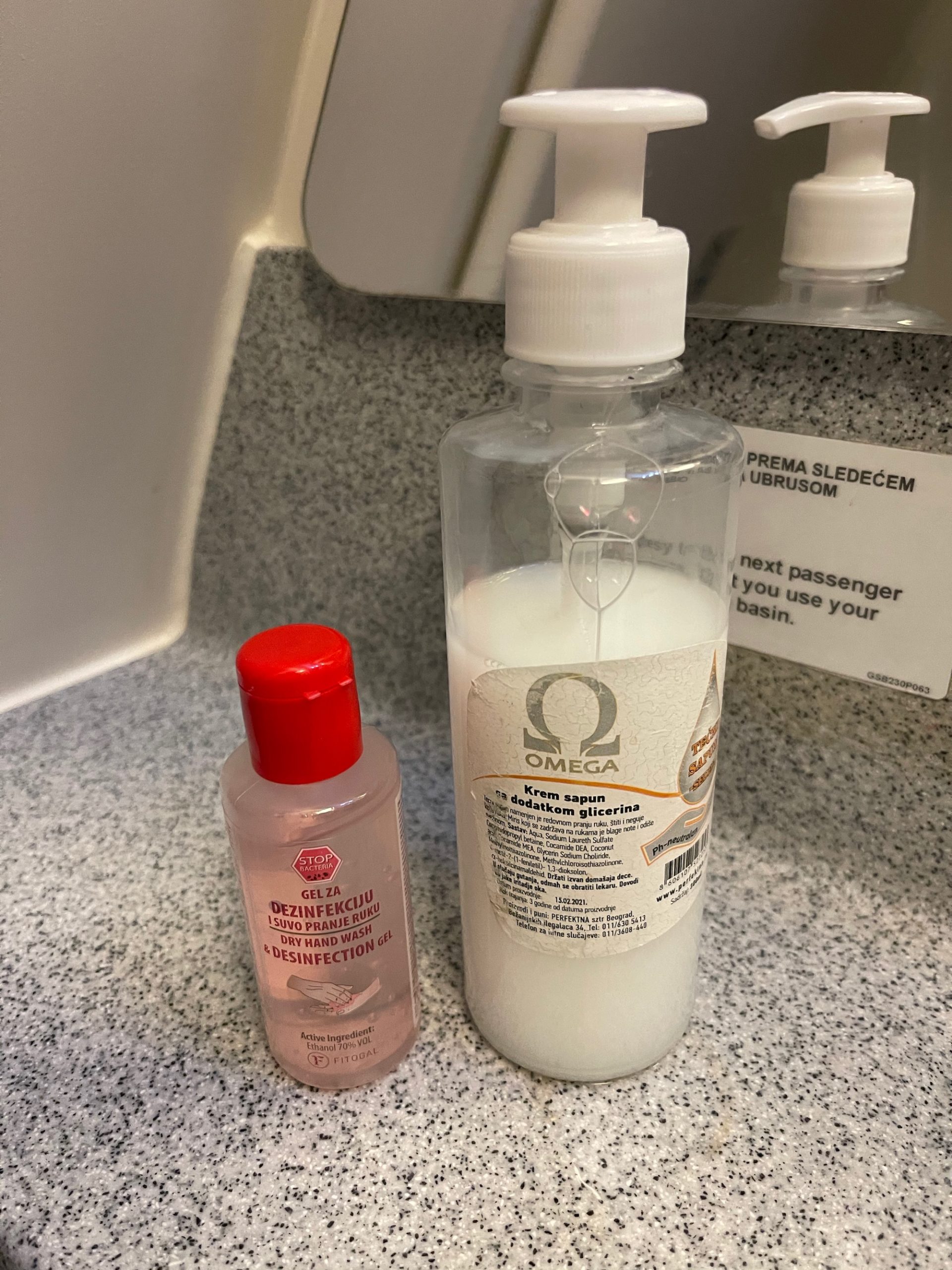 a bottle of hand sanitizer and a small bottle of hand sanitizer