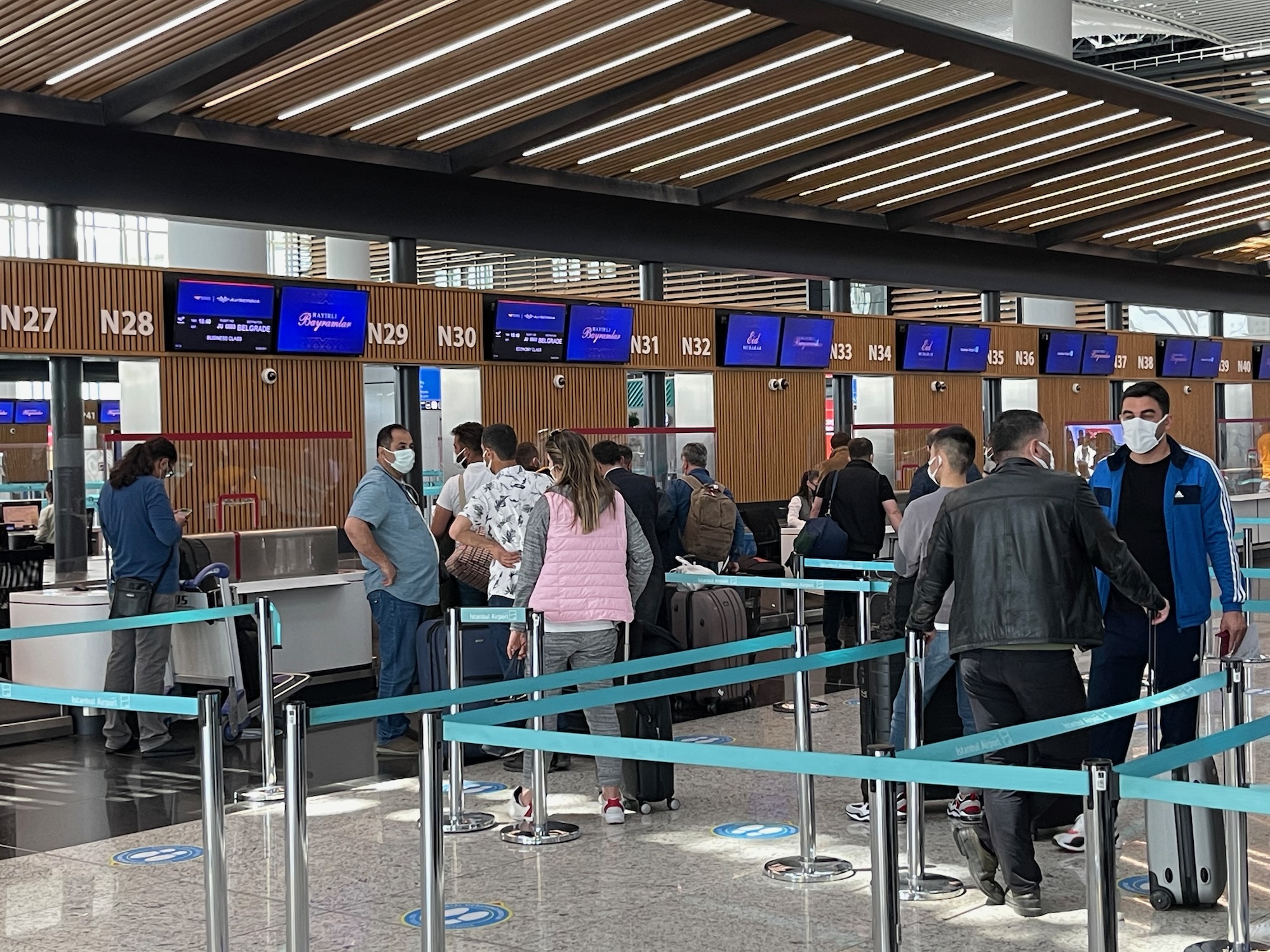 people in a line at an airport