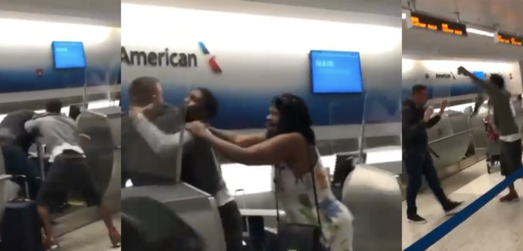 a group of people standing in an airport