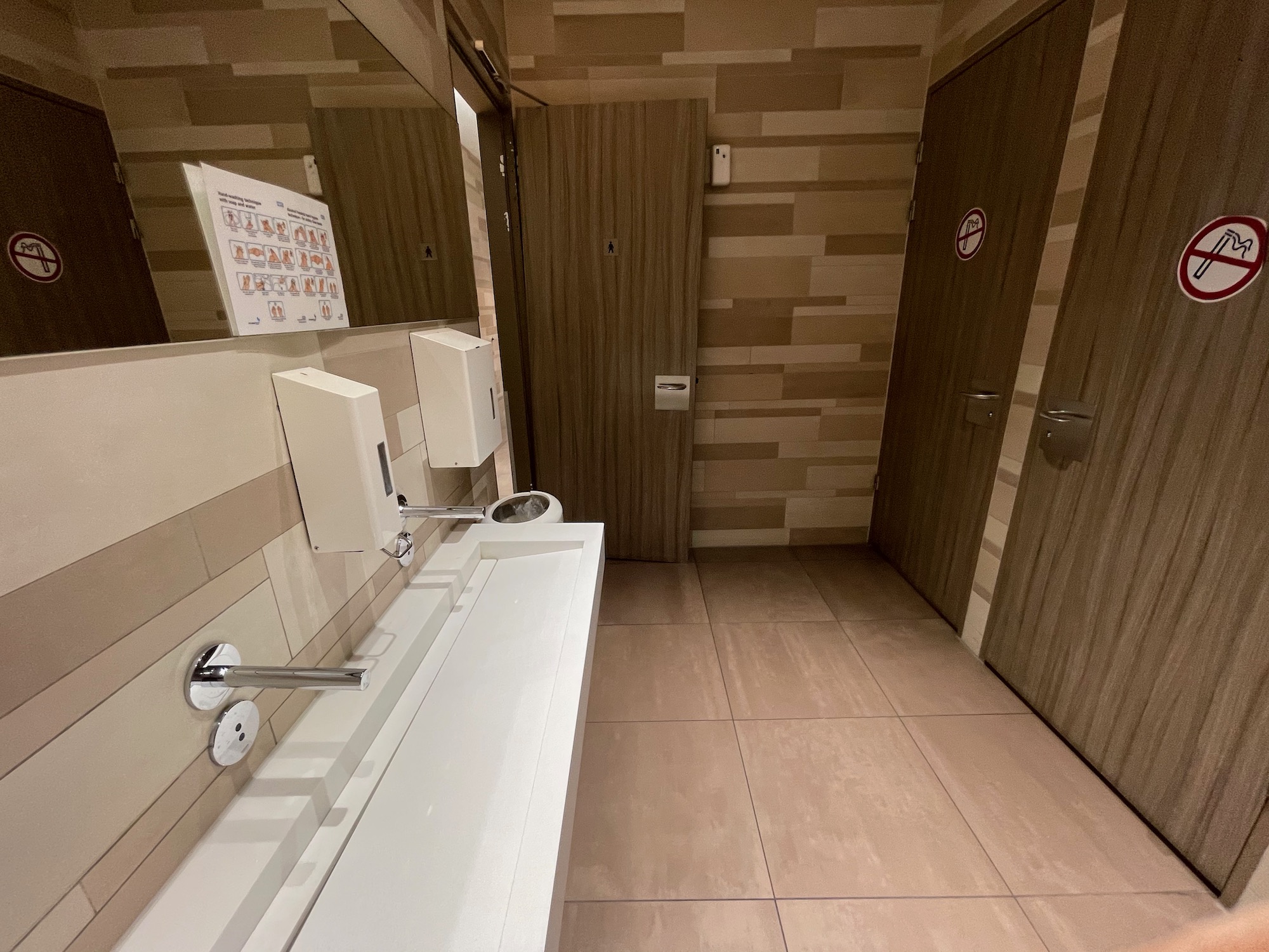 a bathroom with a sink and doors