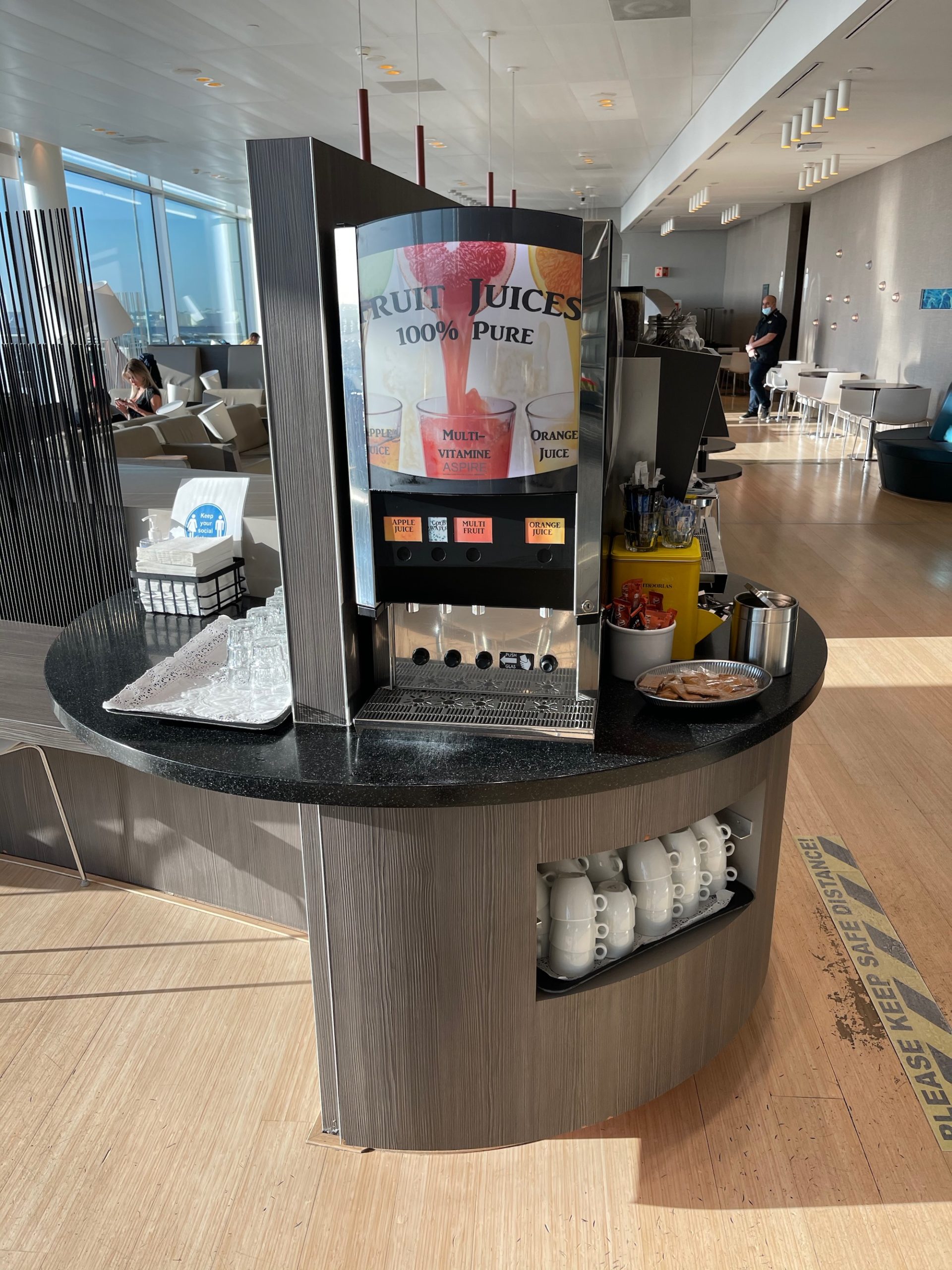 a juice dispenser in a room