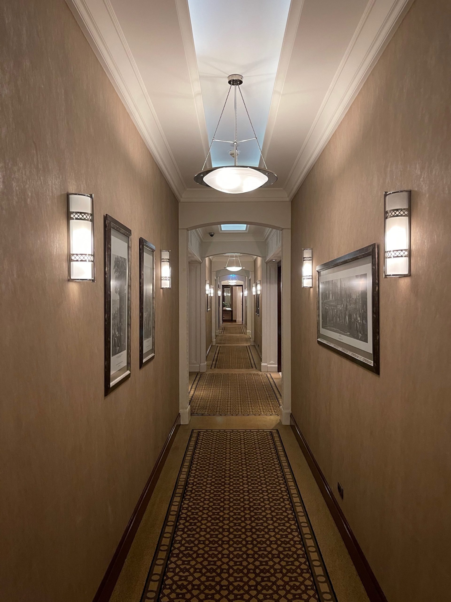 a hallway with pictures on the wall