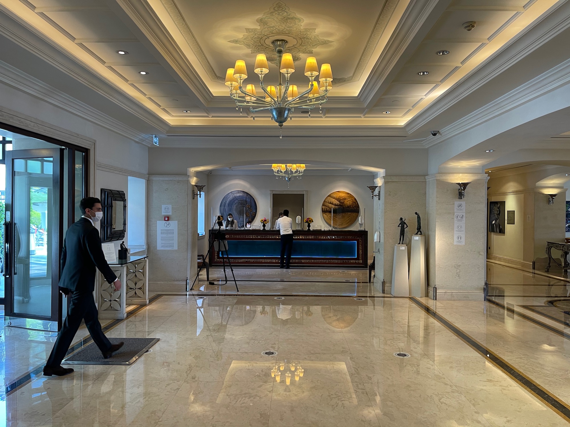 a man walking in a hotel lobby