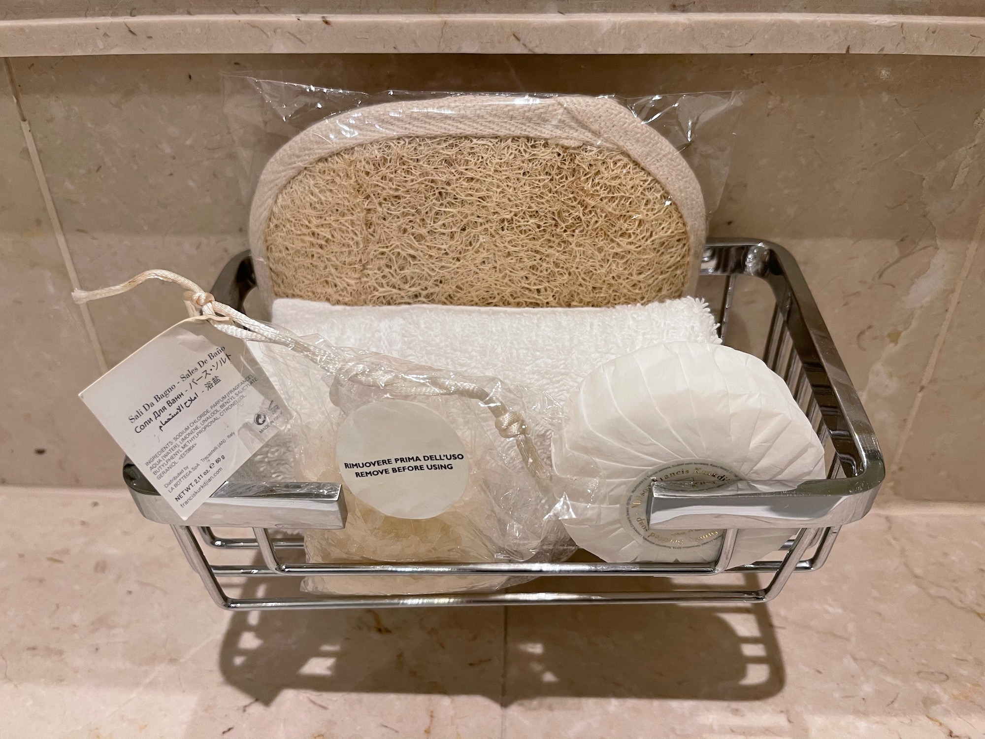 a basket with a loofah sponge and a sponge in it