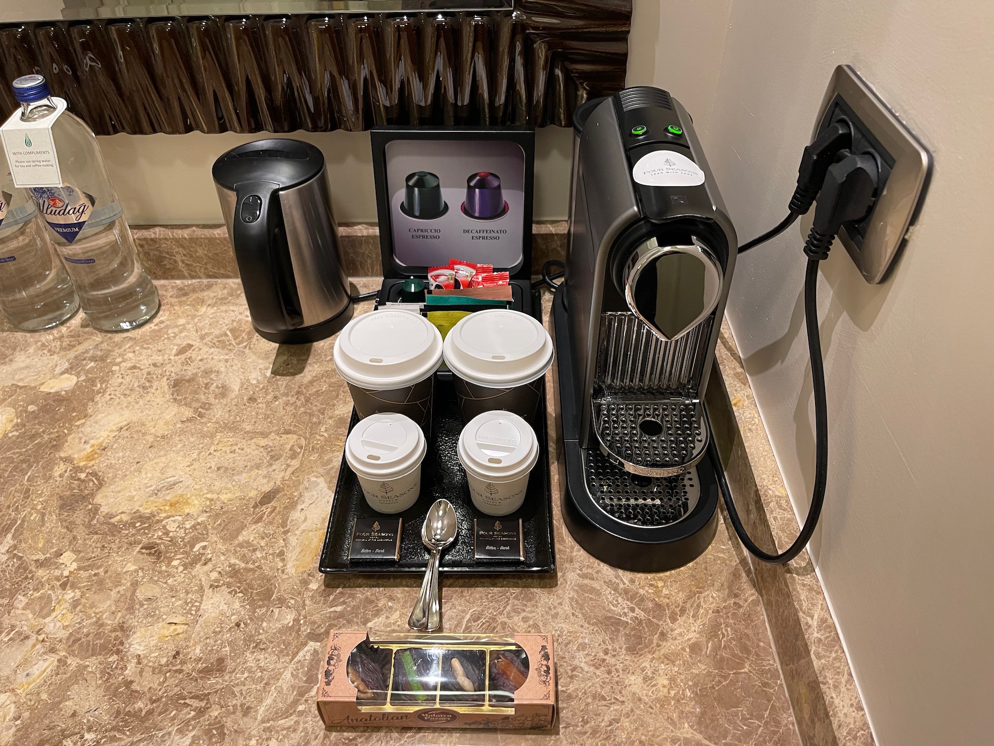 a coffee machine and coffee cups on a counter