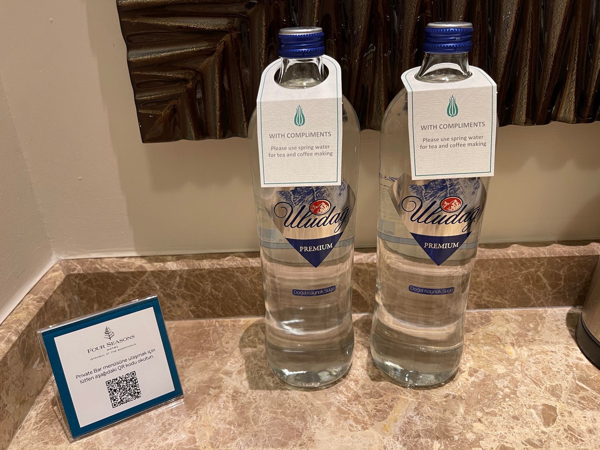 two bottles of water on a counter