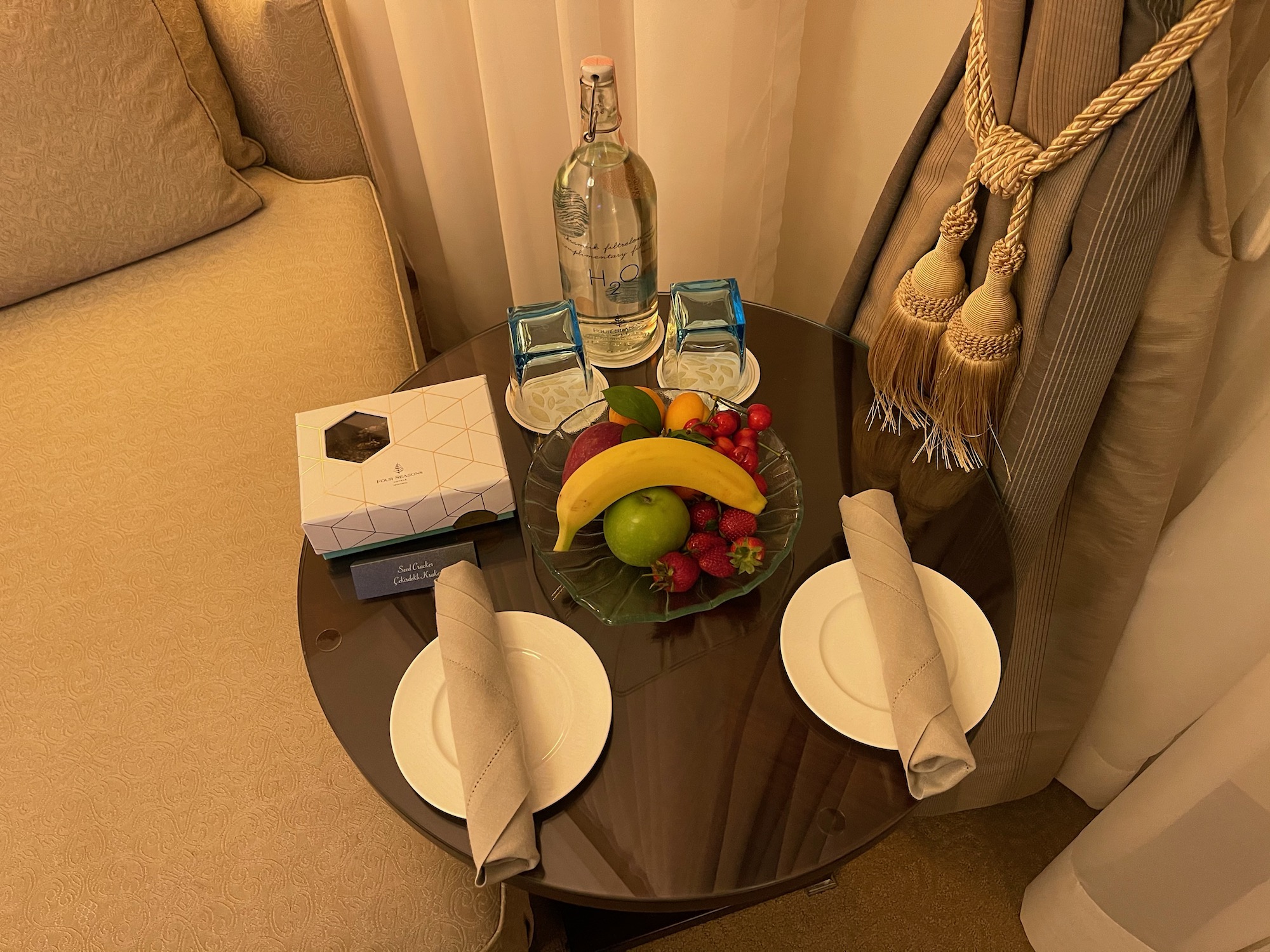 a table with plates and fruit on it