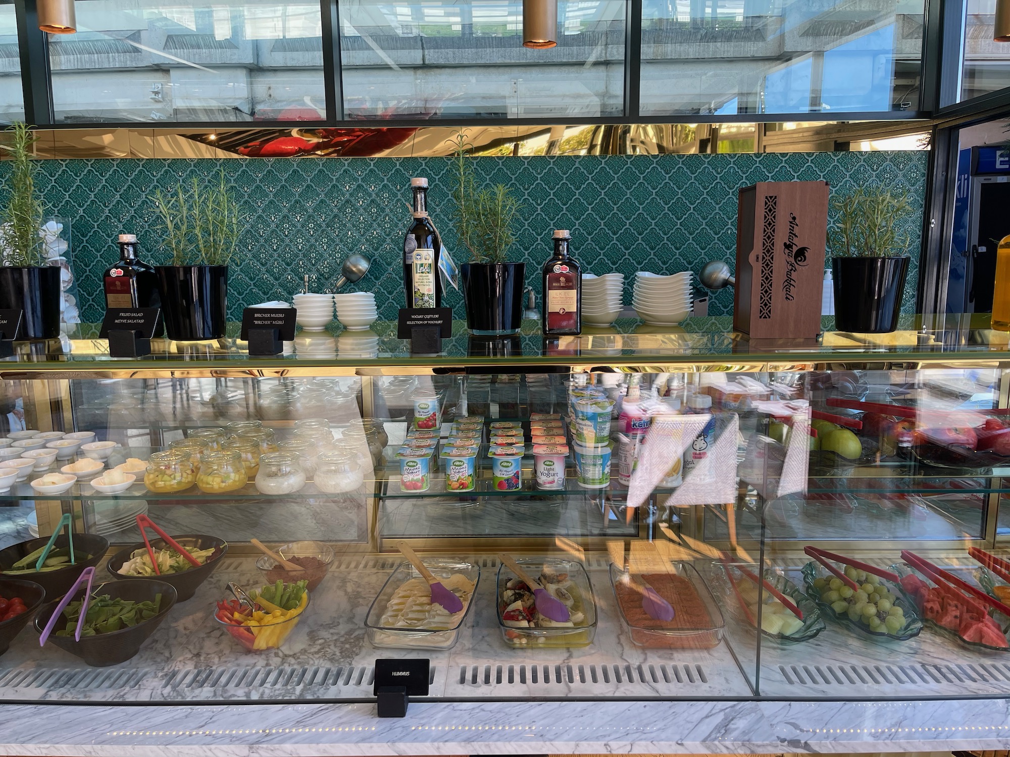 a glass display case with food on it