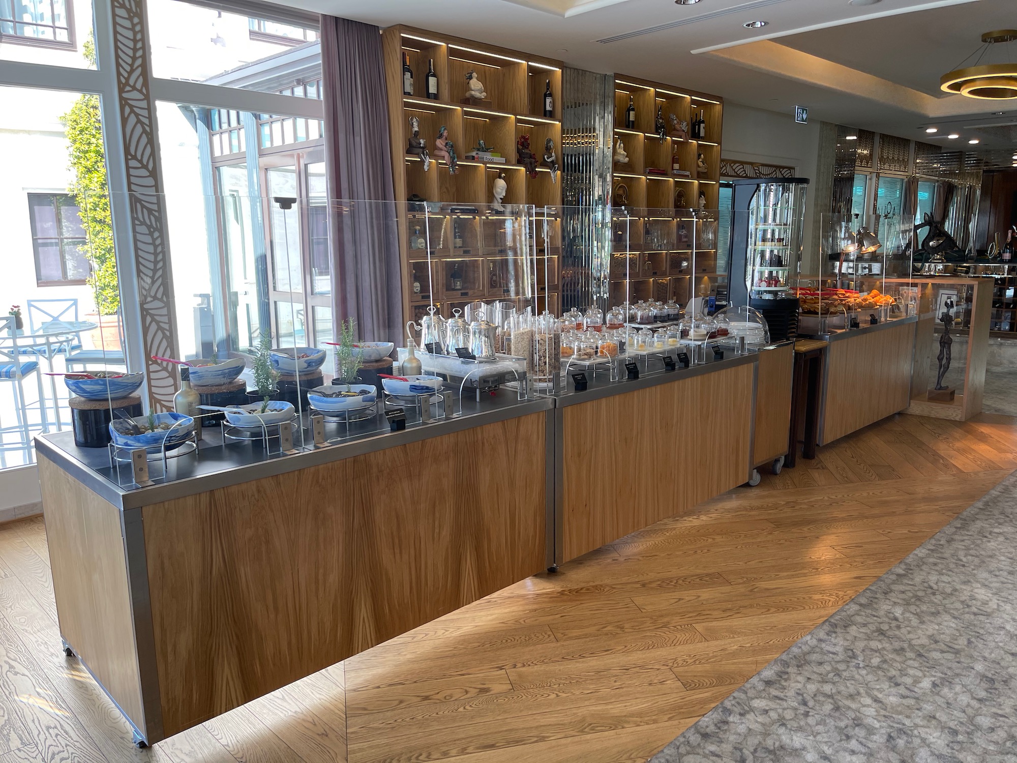 a buffet with a glass display case