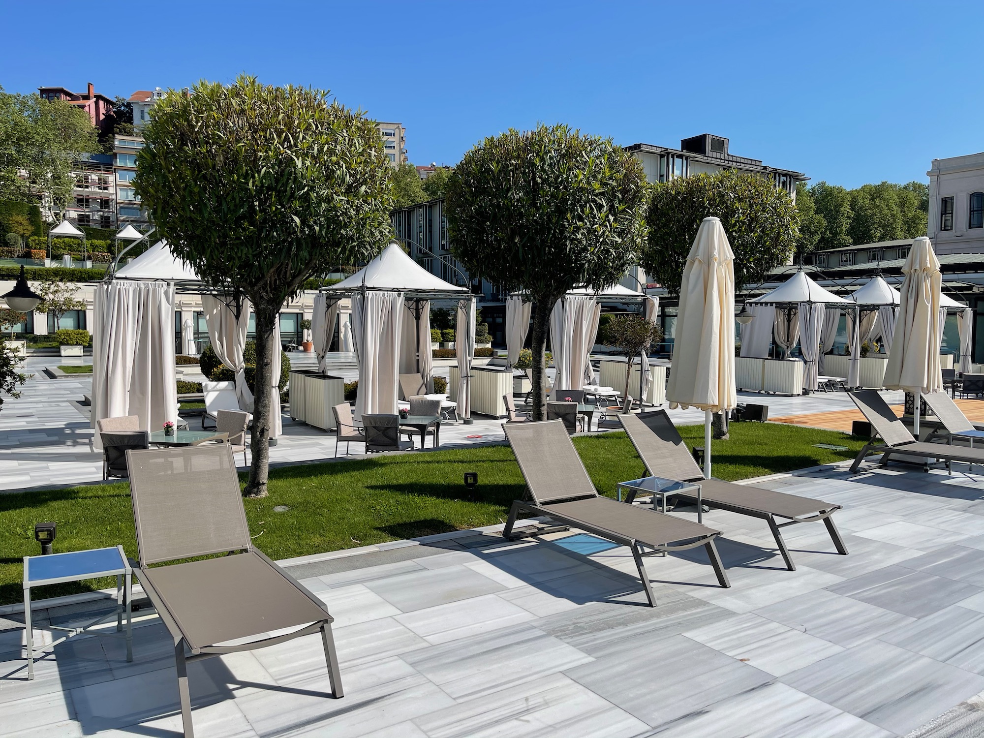 a group of chairs and umbrellas on a patio