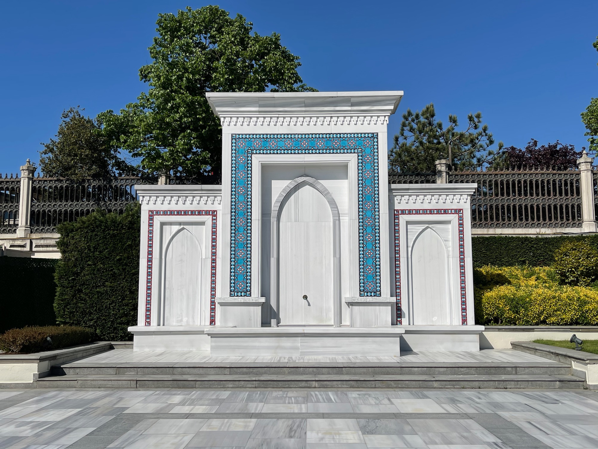 a white building with blue tiles