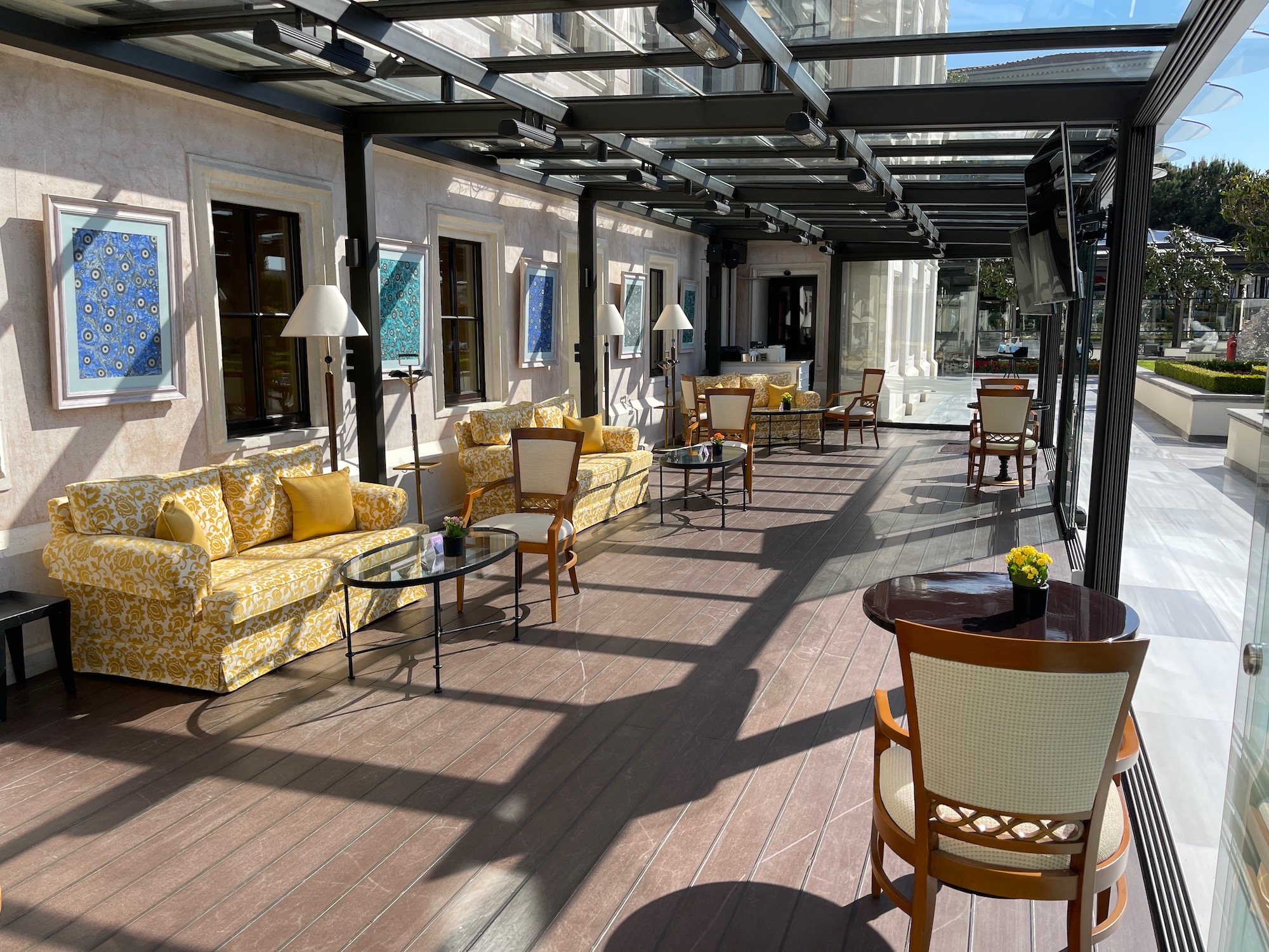 a patio with tables and chairs