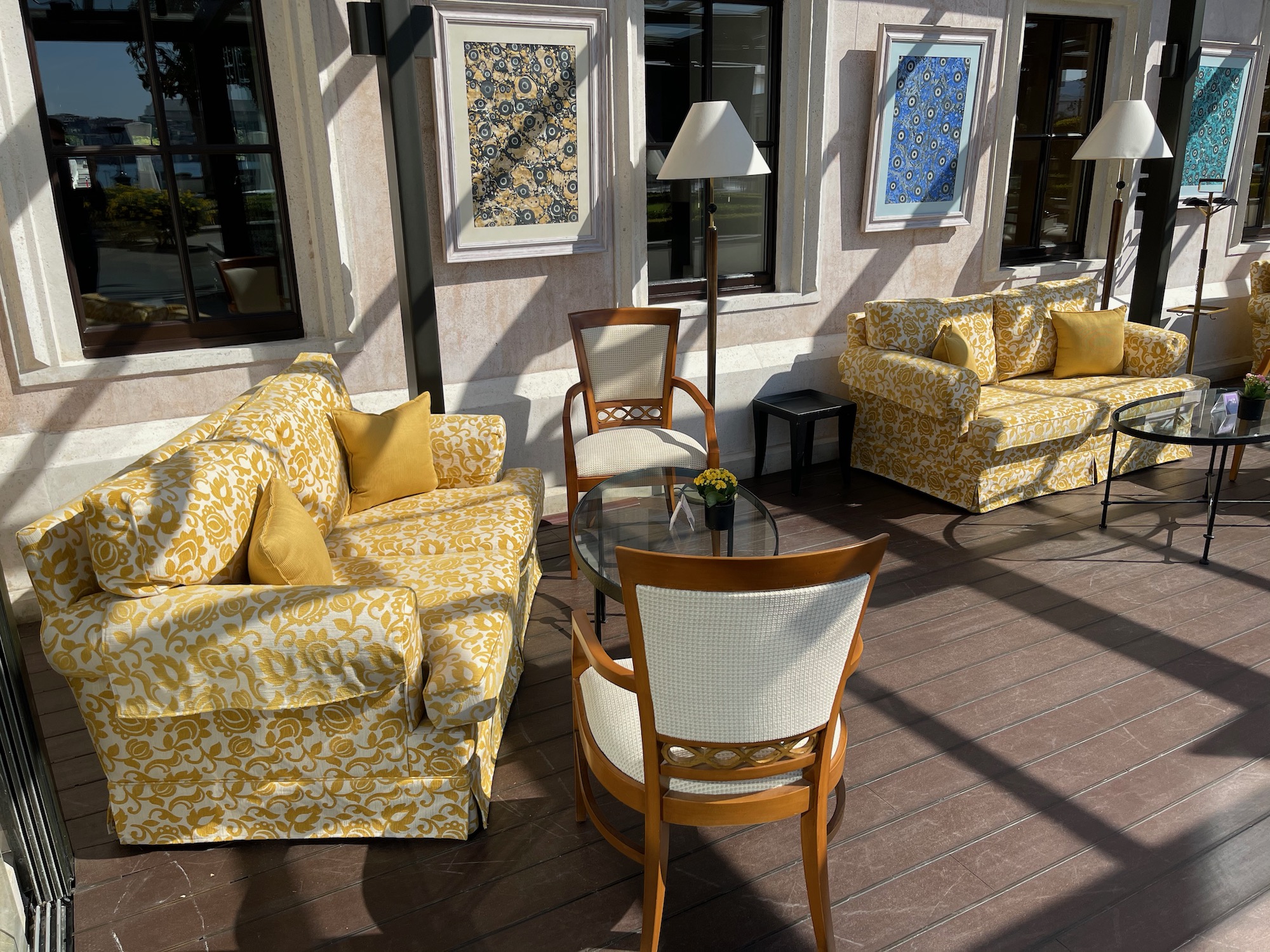 a patio with couches and chairs