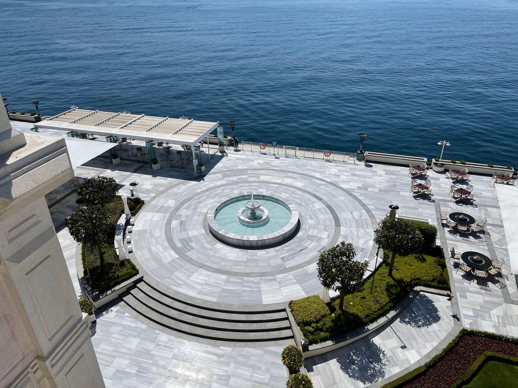 a water fountain on a stone walkway