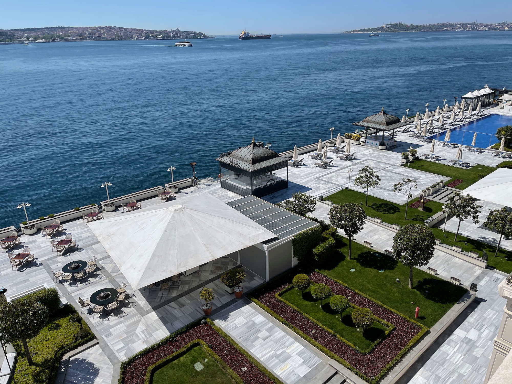 a large body of water with a large building and a gazebo