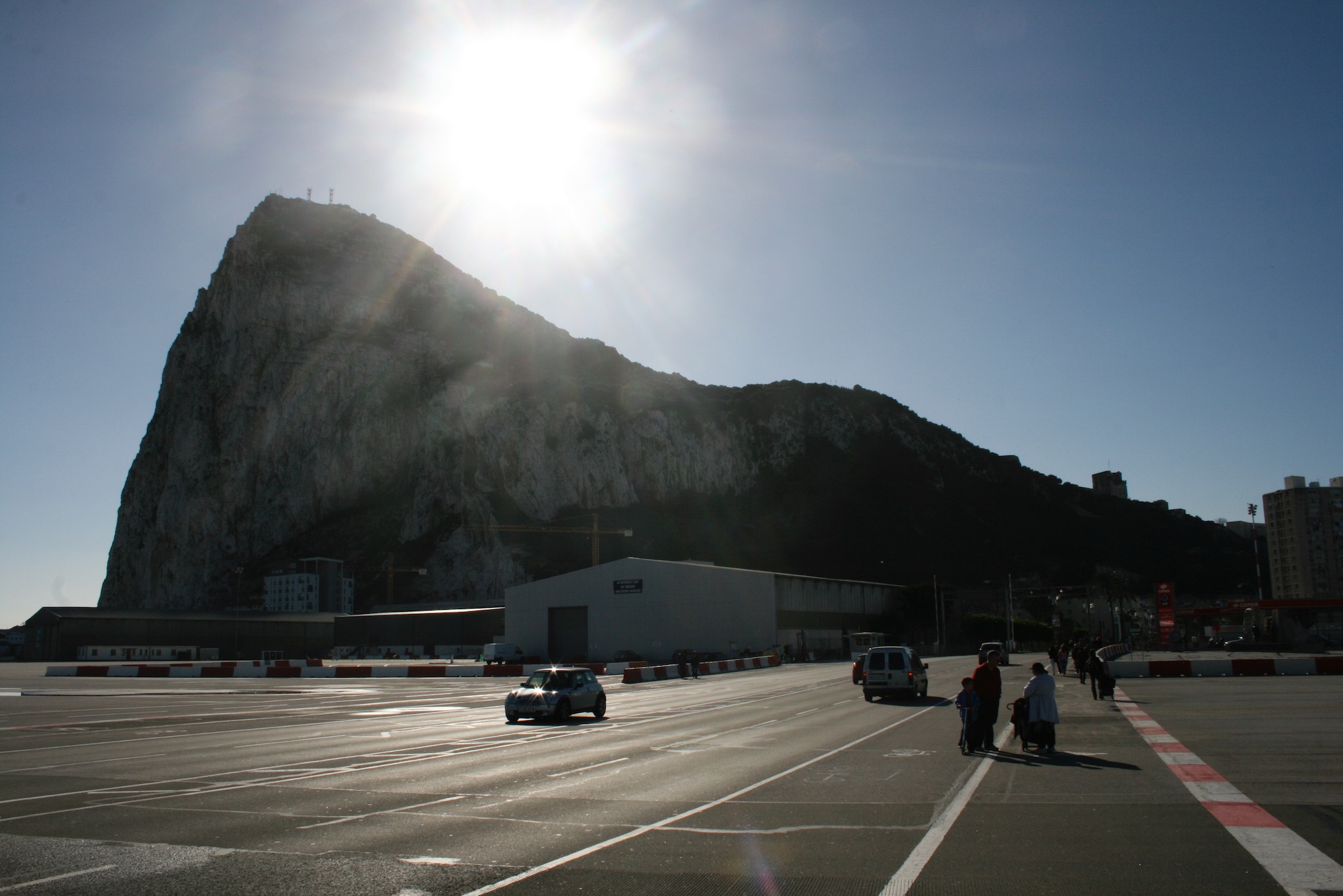 a road with cars and people on it