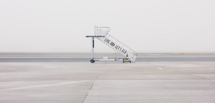 a plane boarding ramp on a runway