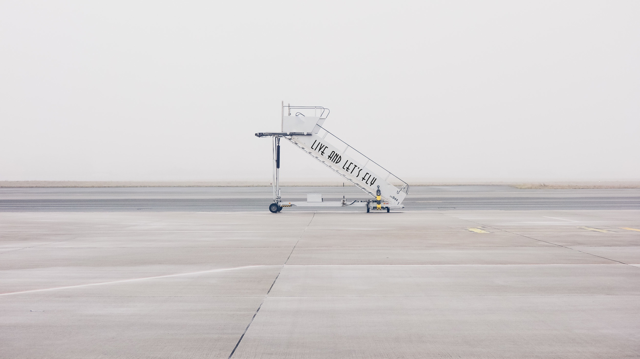 a plane boarding ramp on a runway
