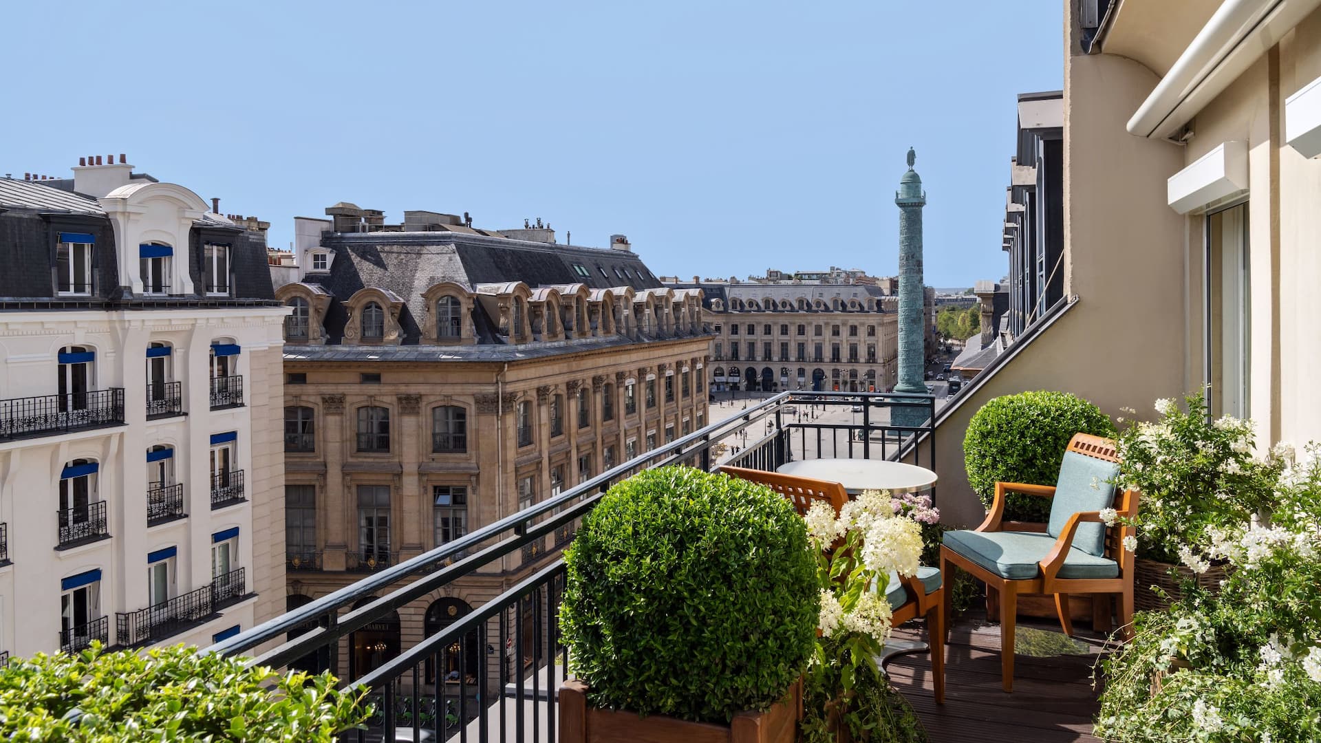 a balcony with a tall tower and a tall building