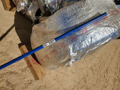 a blue pole on a plastic bag