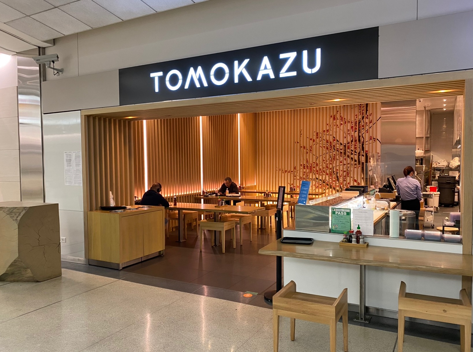 a restaurant with people sitting at tables