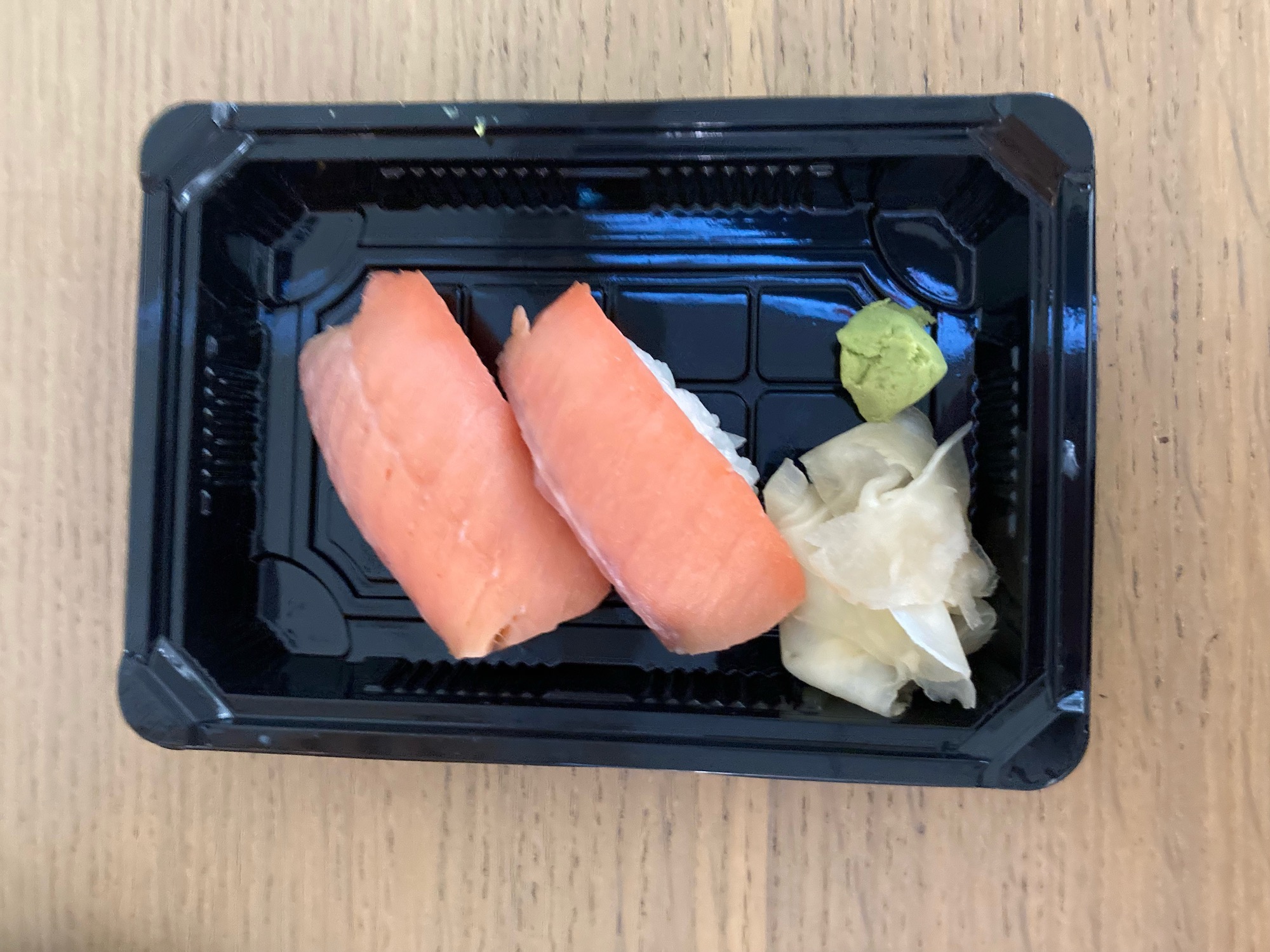 a black container with food on it