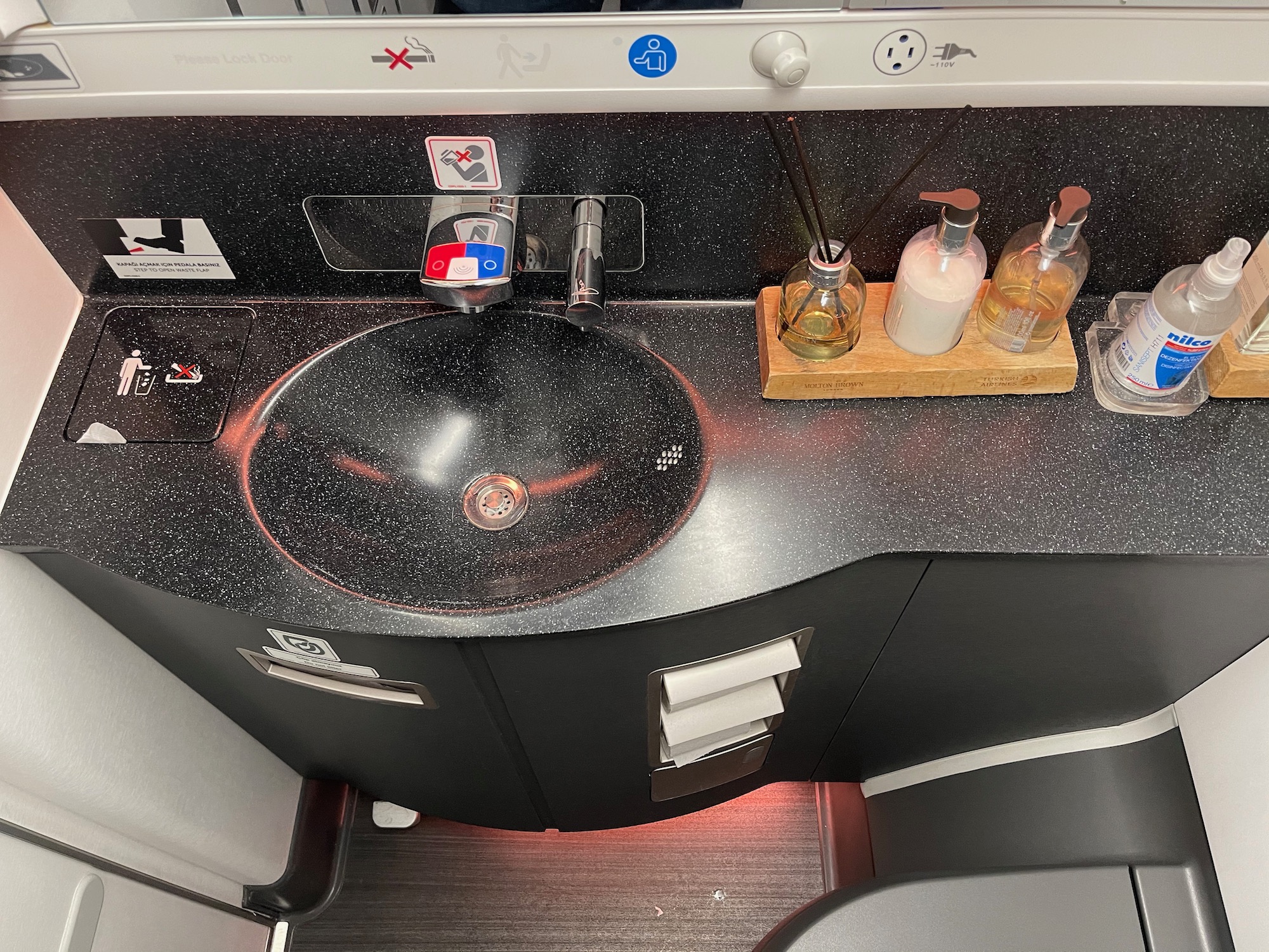 a sink with soap bottles on it