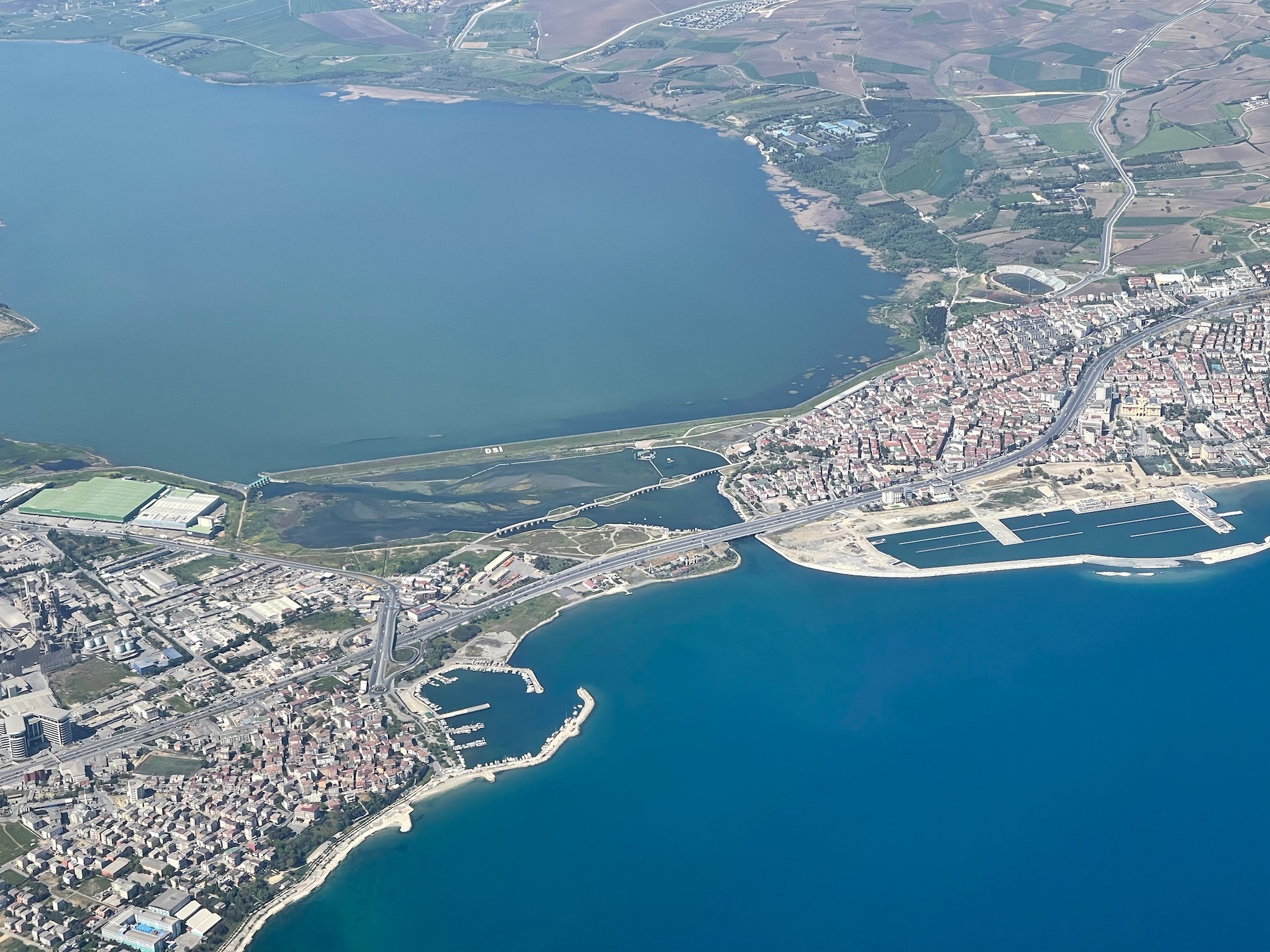 an aerial view of a city and a body of water