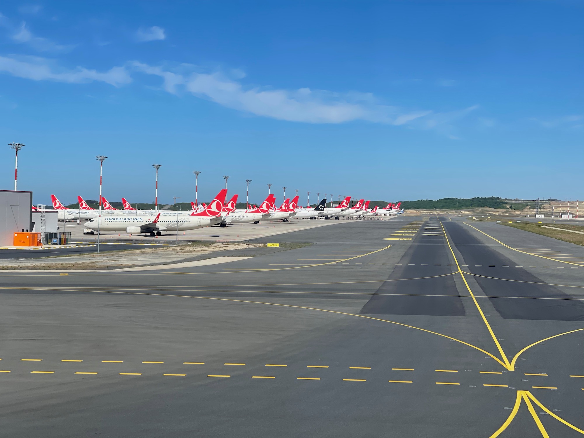 a row of airplanes on a runway