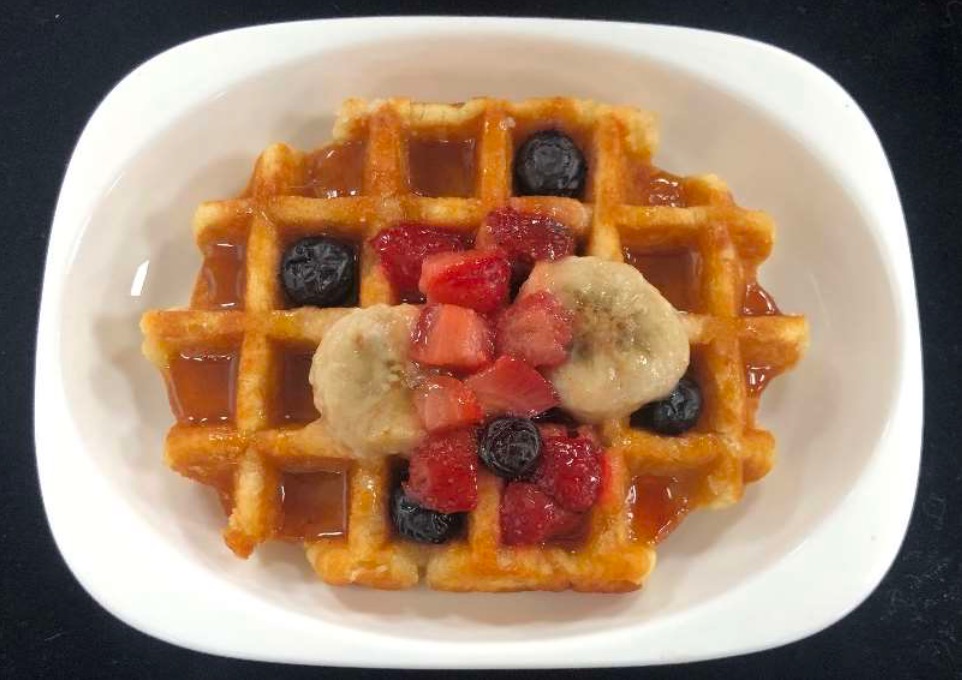a waffle with fruit on top