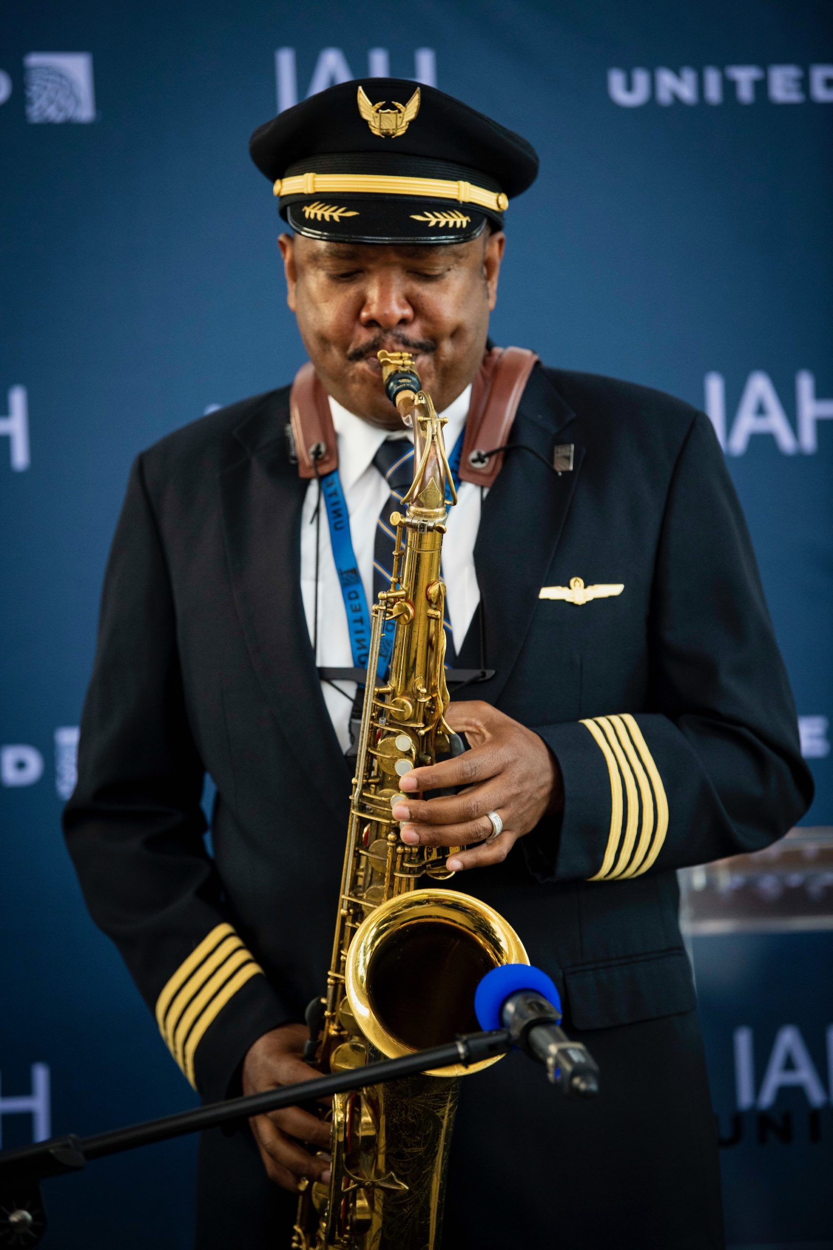 a man in uniform playing a saxophone