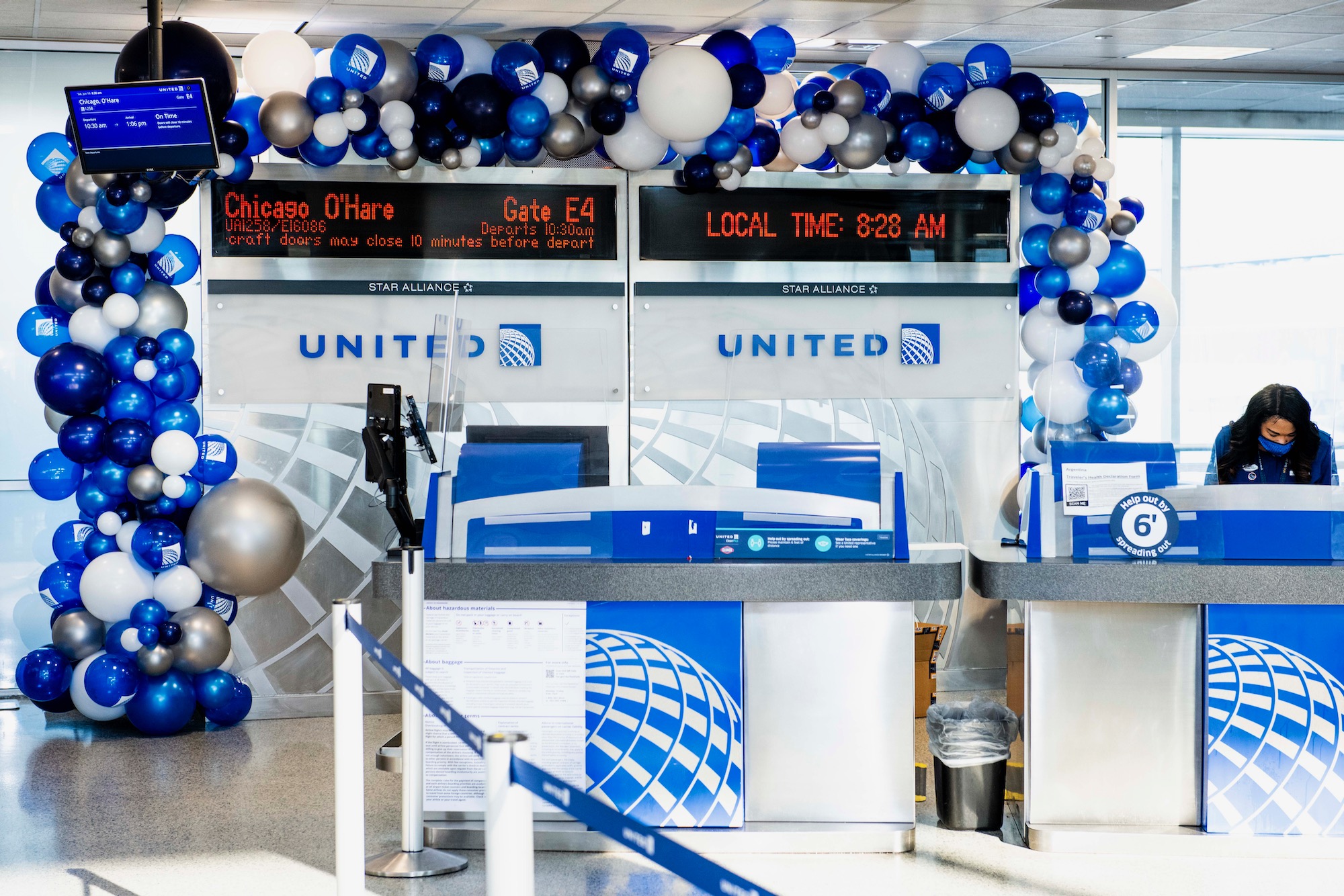 a blue and white balloons in a room