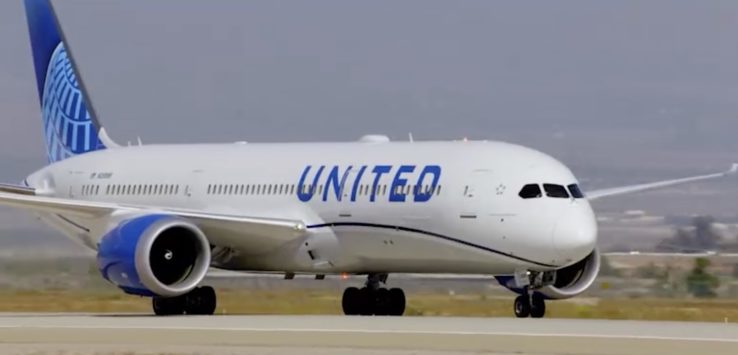 a white airplane on a runway