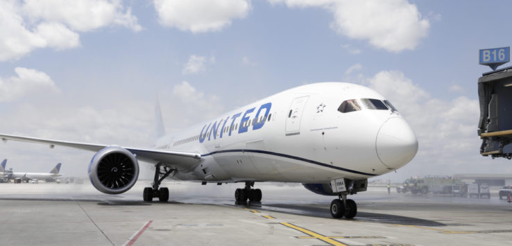 a white airplane on a runway